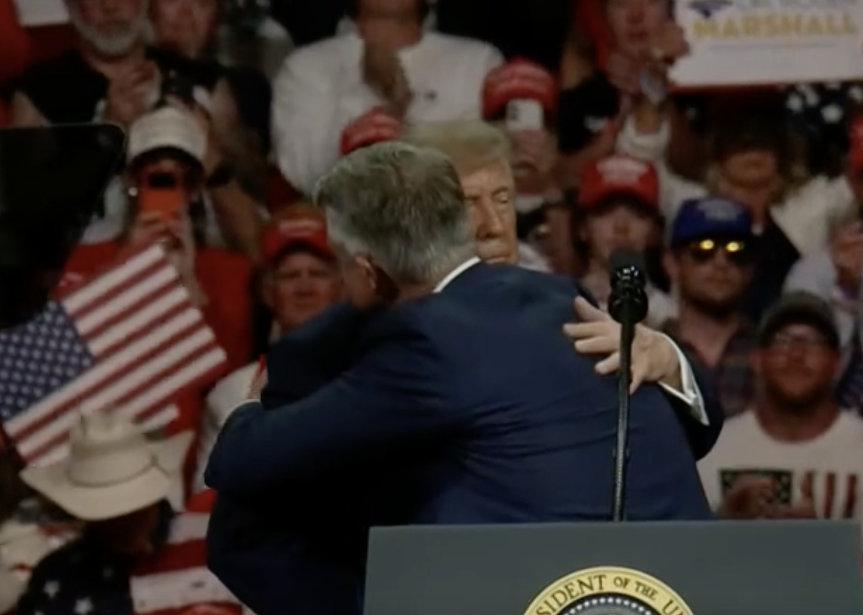 Kansas U.S. Senator Roger Marshall and President Trump embrace on the stage near the end of the rally- image courtesy CSPAN