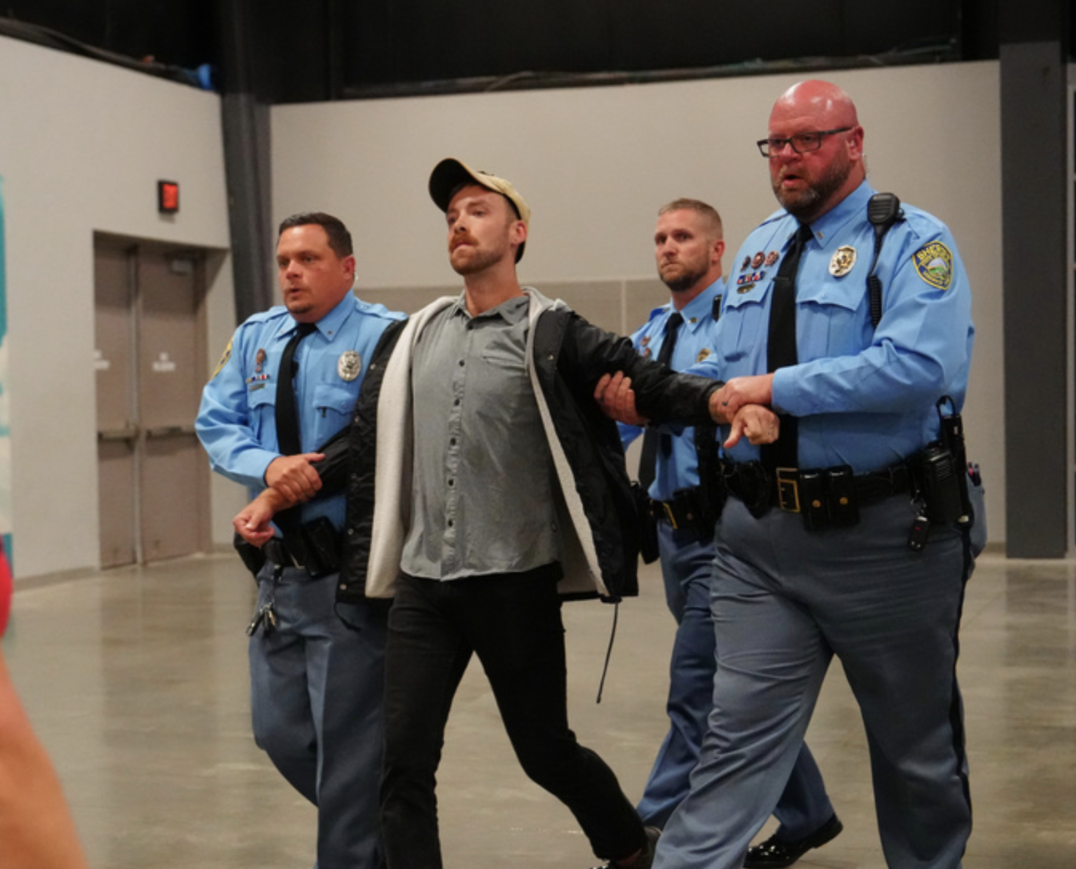 Inside the arena, law enforcement escorted out 11 uninvited individuals who caused disruptions.-photo courtesy KWCH