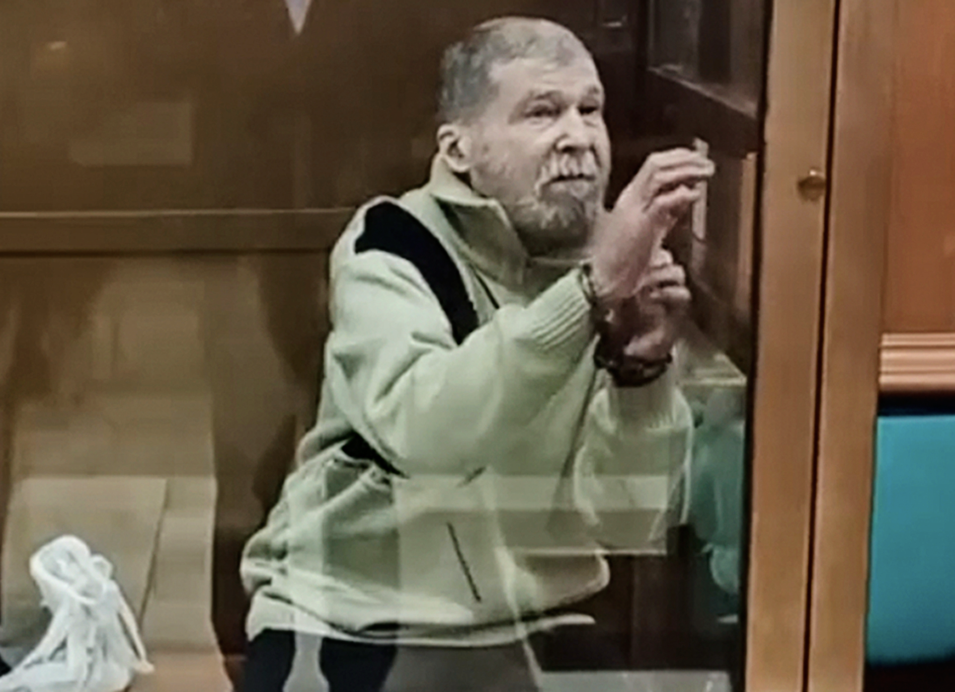 FILE - In this photo taken from video released by the Moscow City Court Press Service, Stephen Hubbard, a U.S. citizen accused of fighting as a mercenary in Ukraine against Russia stands in a glass cage during a court session in the Moscow City court in Moscow, Russia, Oct. 7, 2024. (Moscow City Court Press Service via AP, File)