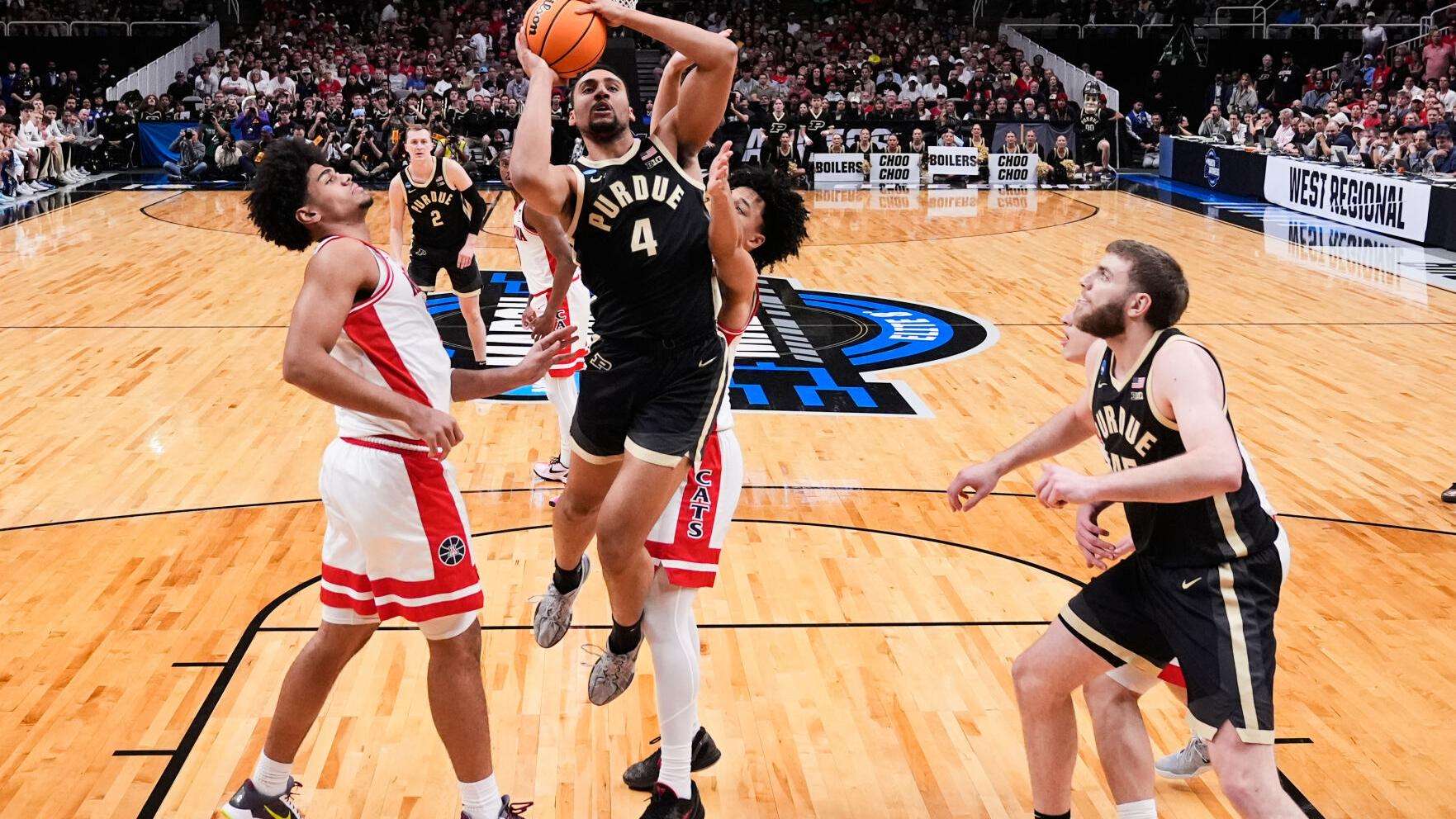 Purdue forward Trey Kaufman-Renn (4) drives to the basket during the first half in the Elite Eight of the NCAA college basketball tournament against Arizona, March 28, 2026, in San Jose, Calif. (AP Photo/Godofredo A. Vásquez, File)