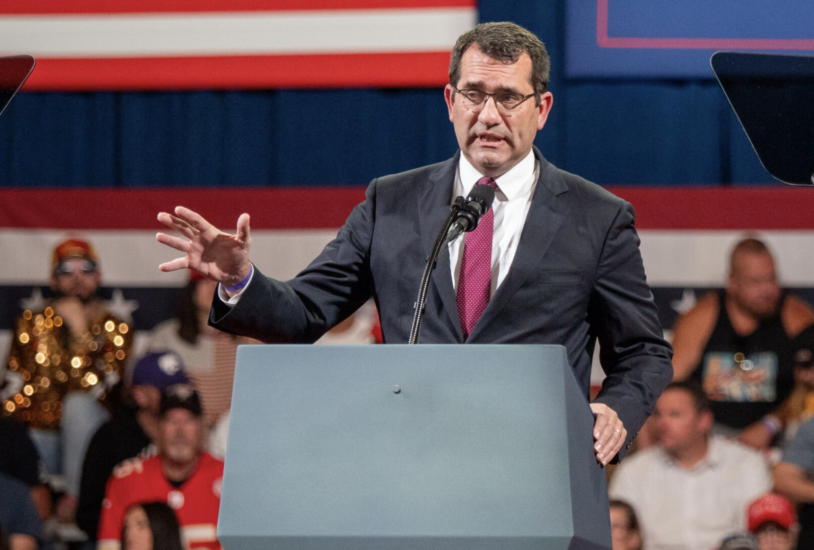 U.S. Rep. Derek Schmidt, R-Kansas, speaks ahead of President Donald Trump at an Oct. 19, 2026, rally at the Heartland Credit Union Arena in Park City. Schmidt is seeking reelection against Democratic nominee Don Coover. (Photo by Sherman Smith/Kansas Reflector)