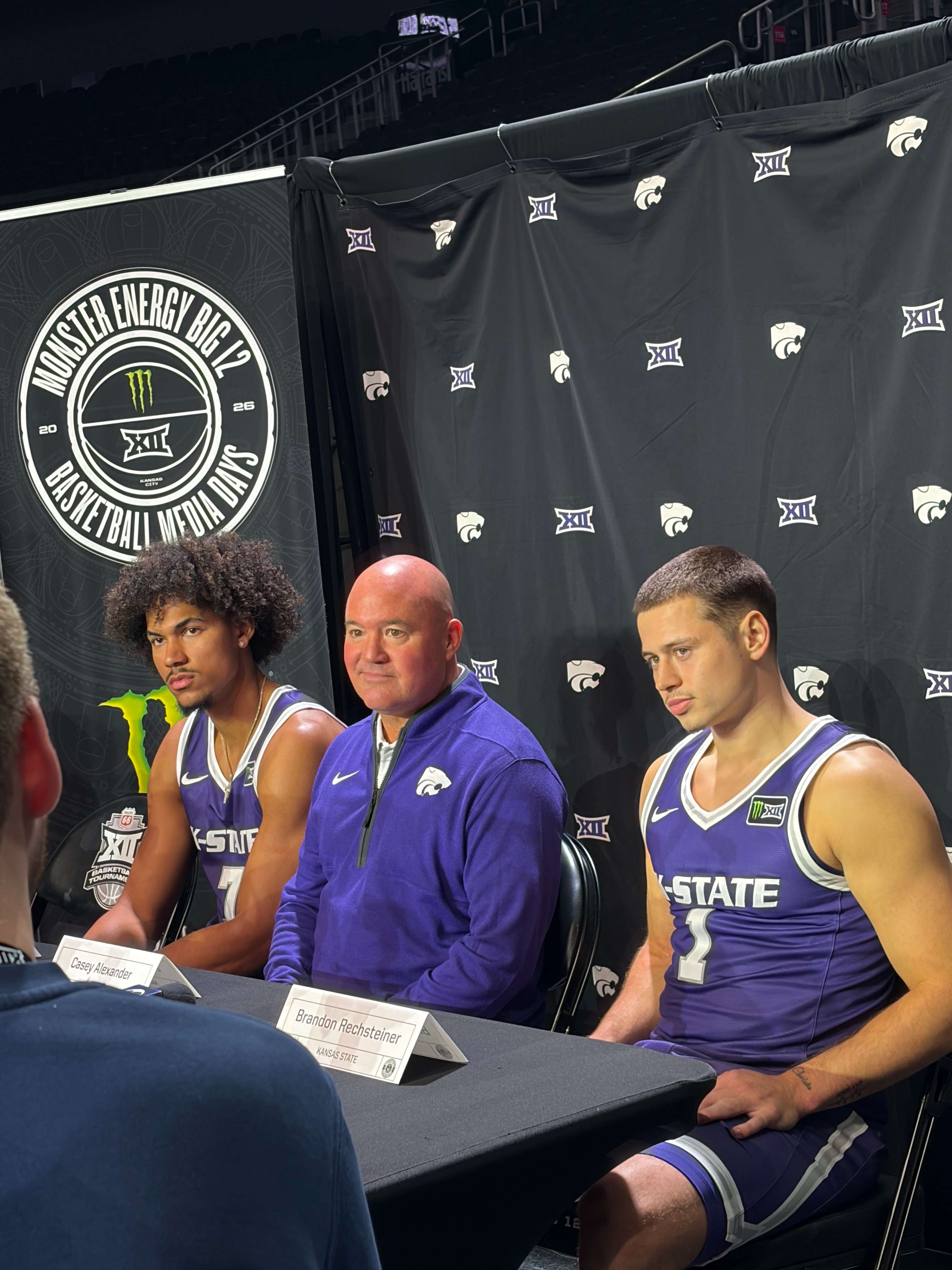 KSU Men's Basketball at Day 2 of Big 12 Media Days at T-Mobile Center in Kansas City, Missouri. (Pictured left-to-right) - junior foward Isaiah Abraham, new head basketball coach Casey Alexander, and senior guard Brandon Rechsteiner.