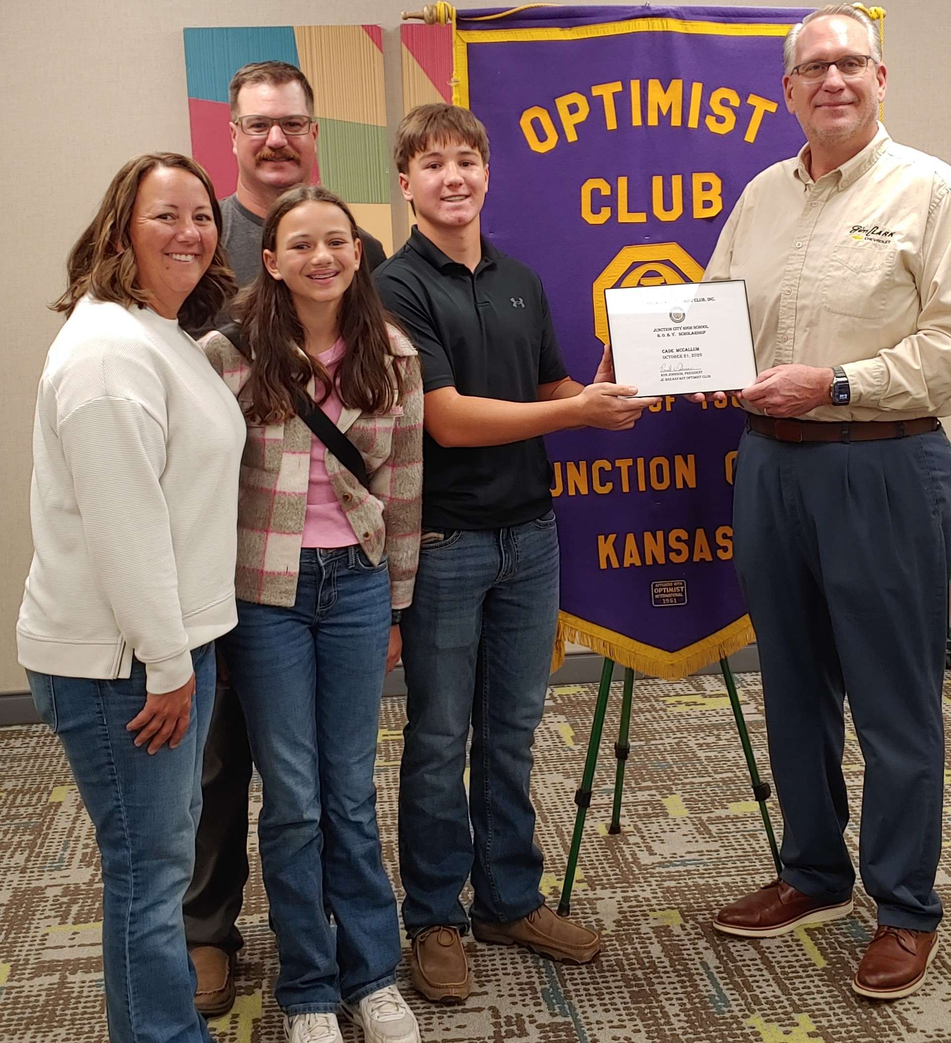 Pictured left to right are: Kelli McCallum, Caden's mother; Jeremy McCallum, Caden's father; Kinley McCalllum, Caden's sister; Caden and Ron Johnson, JC Breakfast Optimist Club President.&nbsp;