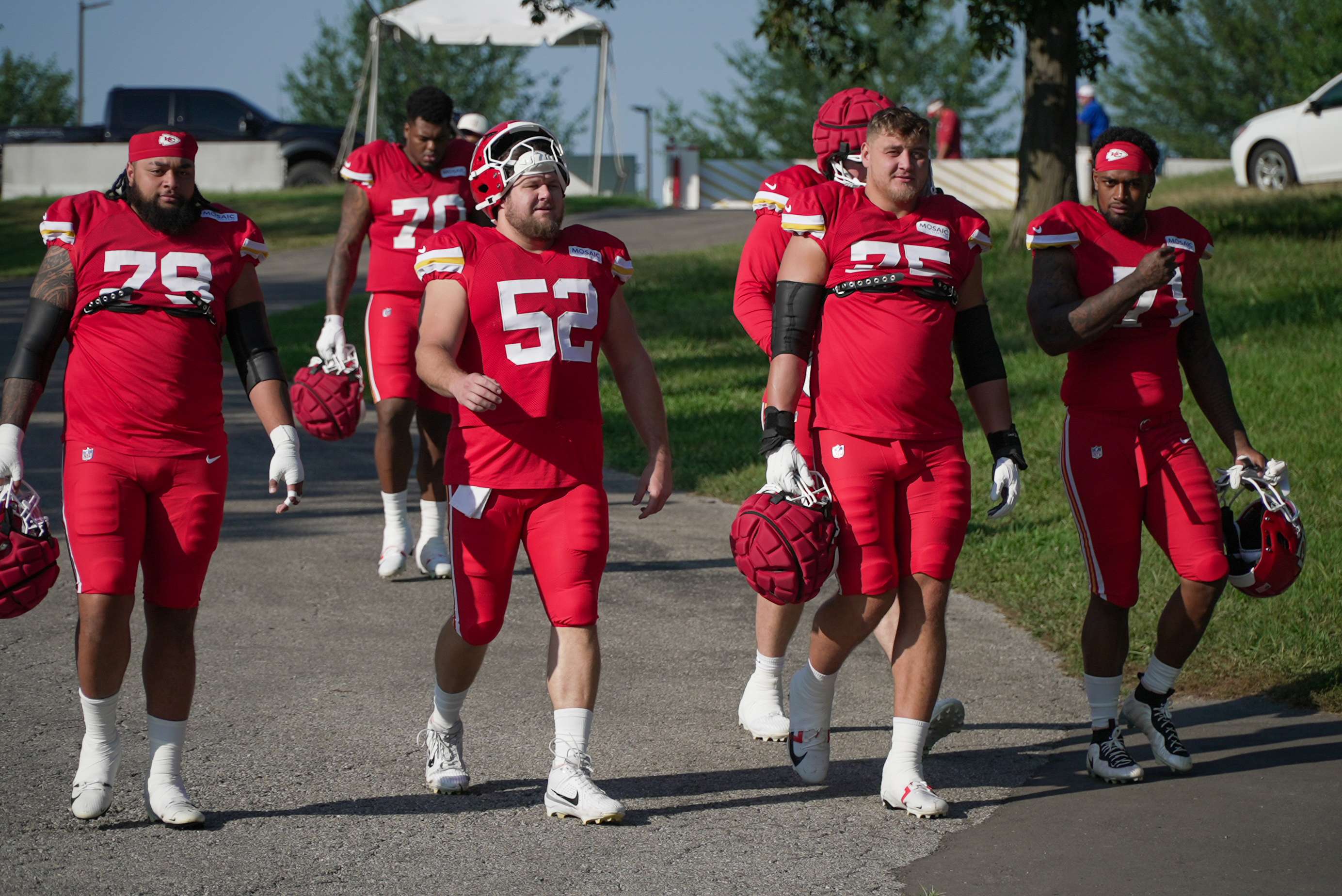 Chiefs left tackle Josh Simmons (far right) makes his way down the hill with fellow offensive lineman during Chiefs Training Camp. Simmons was placed on injured reserve by Kansas City on Tuesday/ Photo by Justin Peacock