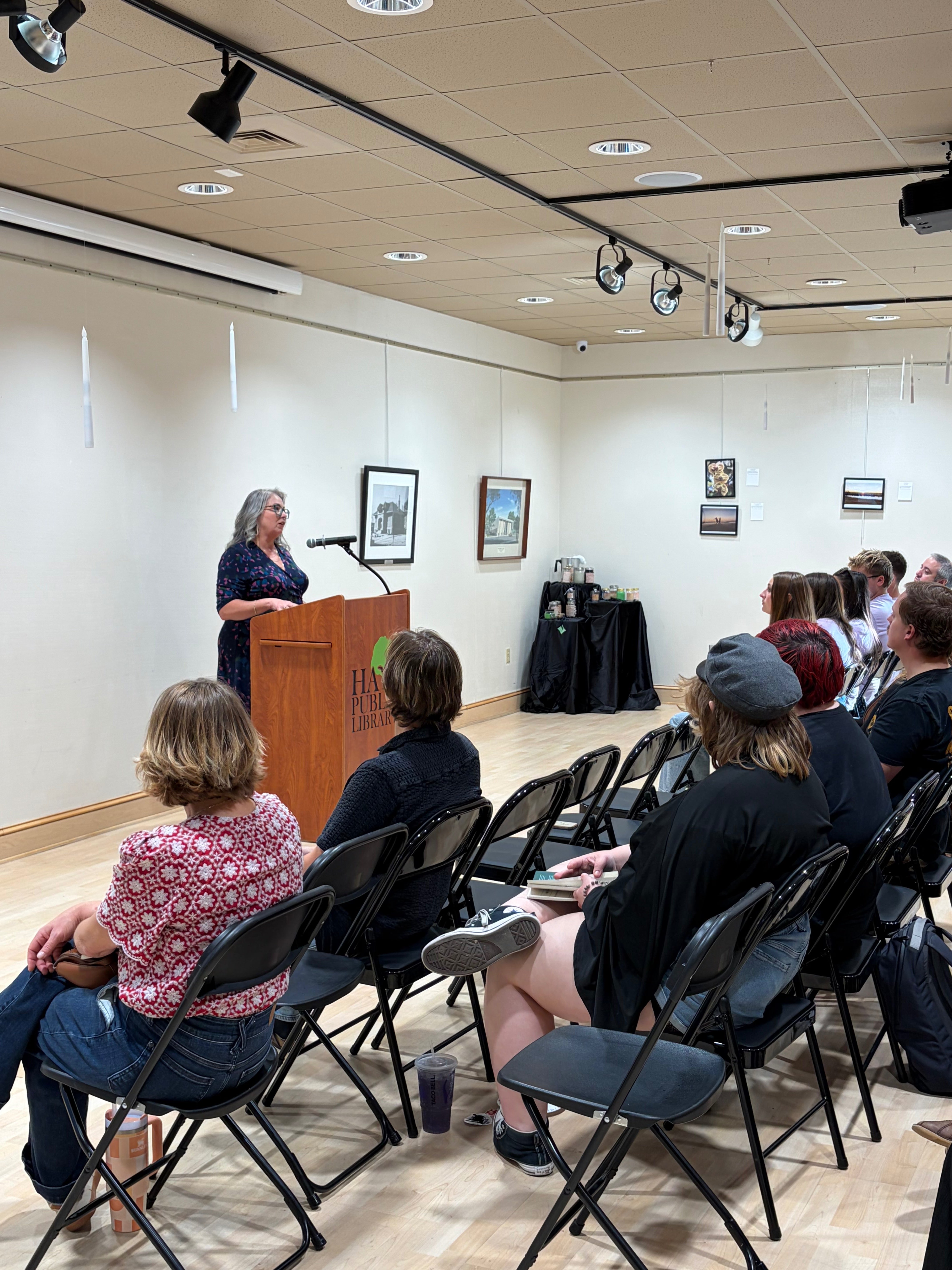 Jennifer Hecker, executive director for Options Domestic and Sexual Violence Services, speaks to the audience about the importance of bringing stories to life and how to help. Photo by Alin Hett/Hays Post.&nbsp;
