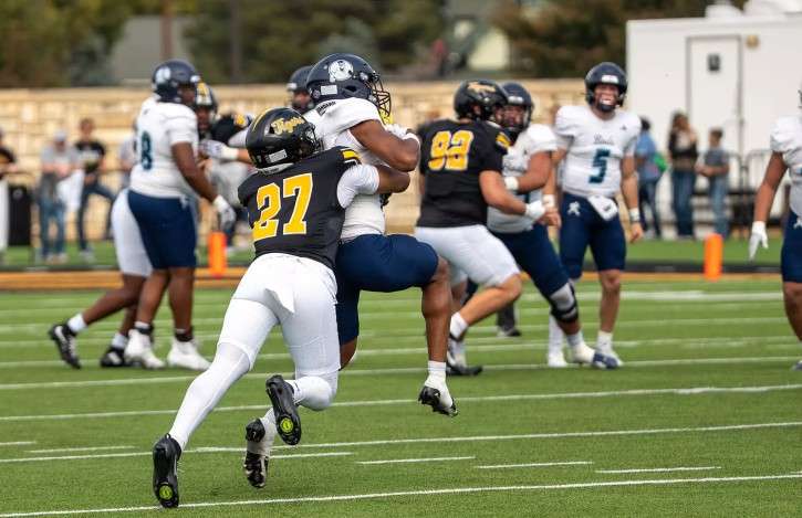 Fort Hays State's Donovan Guyton (27) makes a tackle in the first half of an MIAA football game against Washburn on Saturday, October 24, 2026 in Hays Kan. (FHSU Athletics photo/Madyson Schliep)