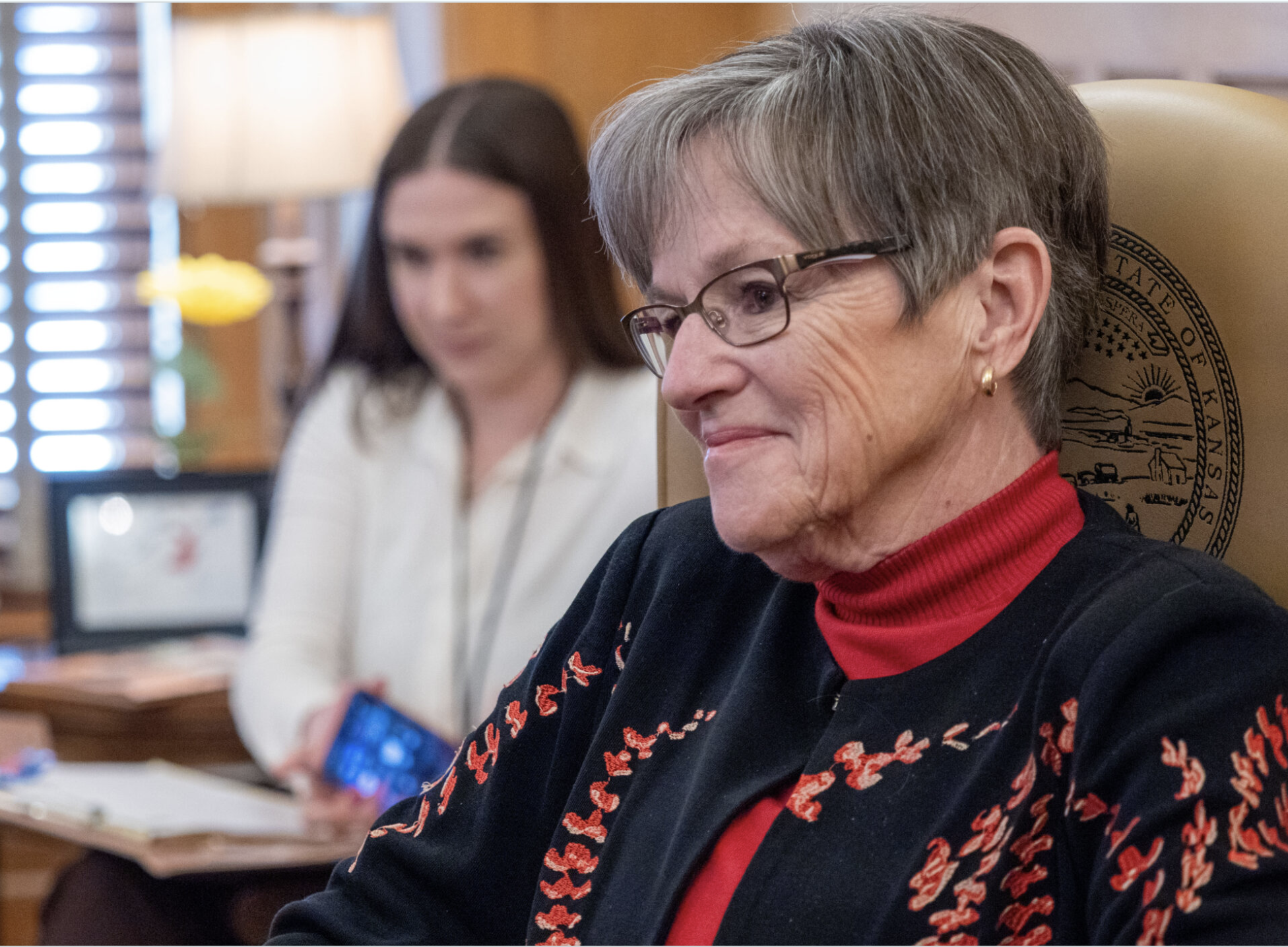 Gov. Laura Kelly answers a reporter’s questions during a Feb. 24, 2026, interview in her office at the Statehouse in Topeka. (Photo by Sherman Smith/Kansas Reflector)