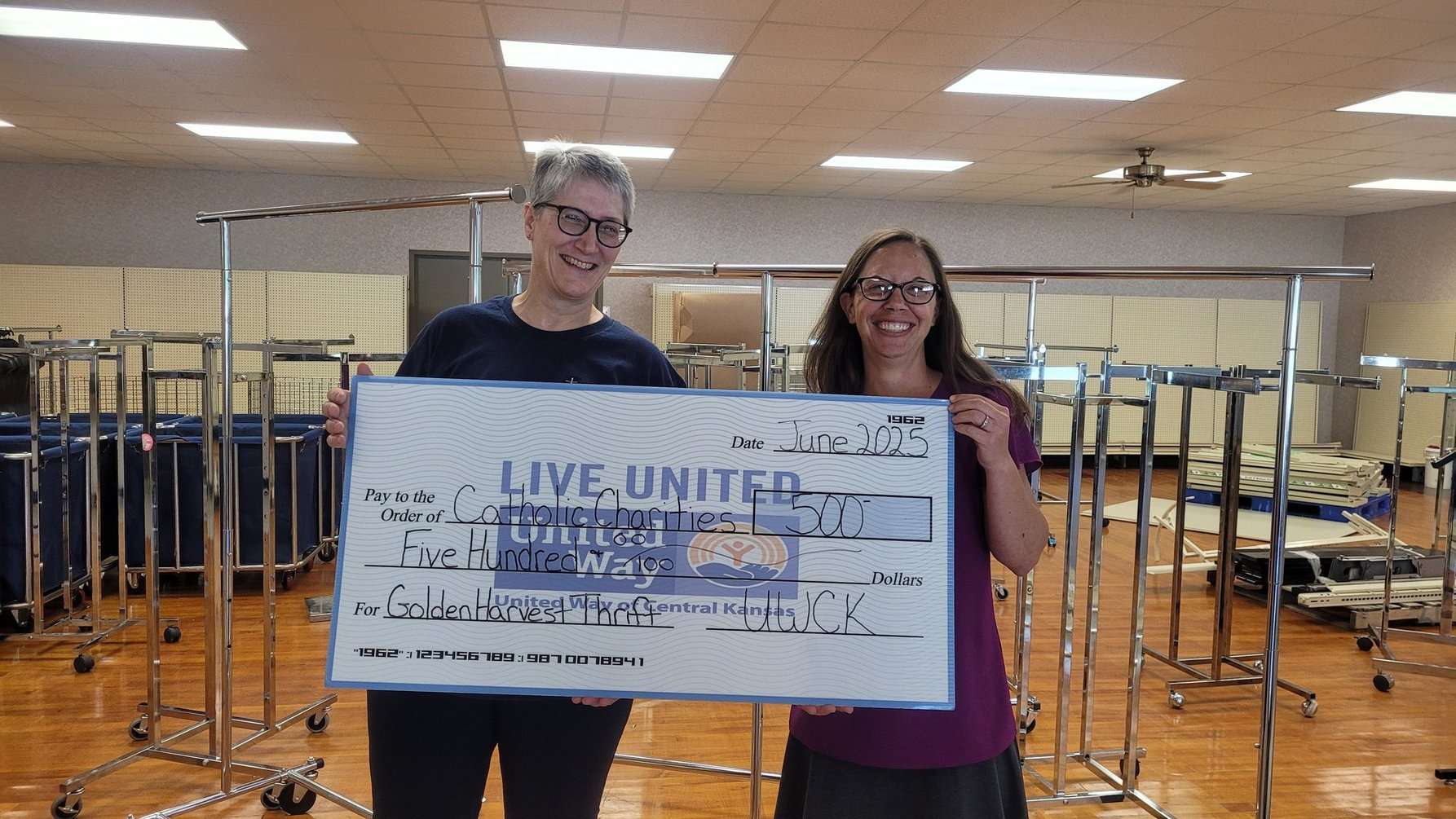 UWCK Executive Director Charell Owings with Rebecca Ford of Catholic Charities of Southwest Kansas.