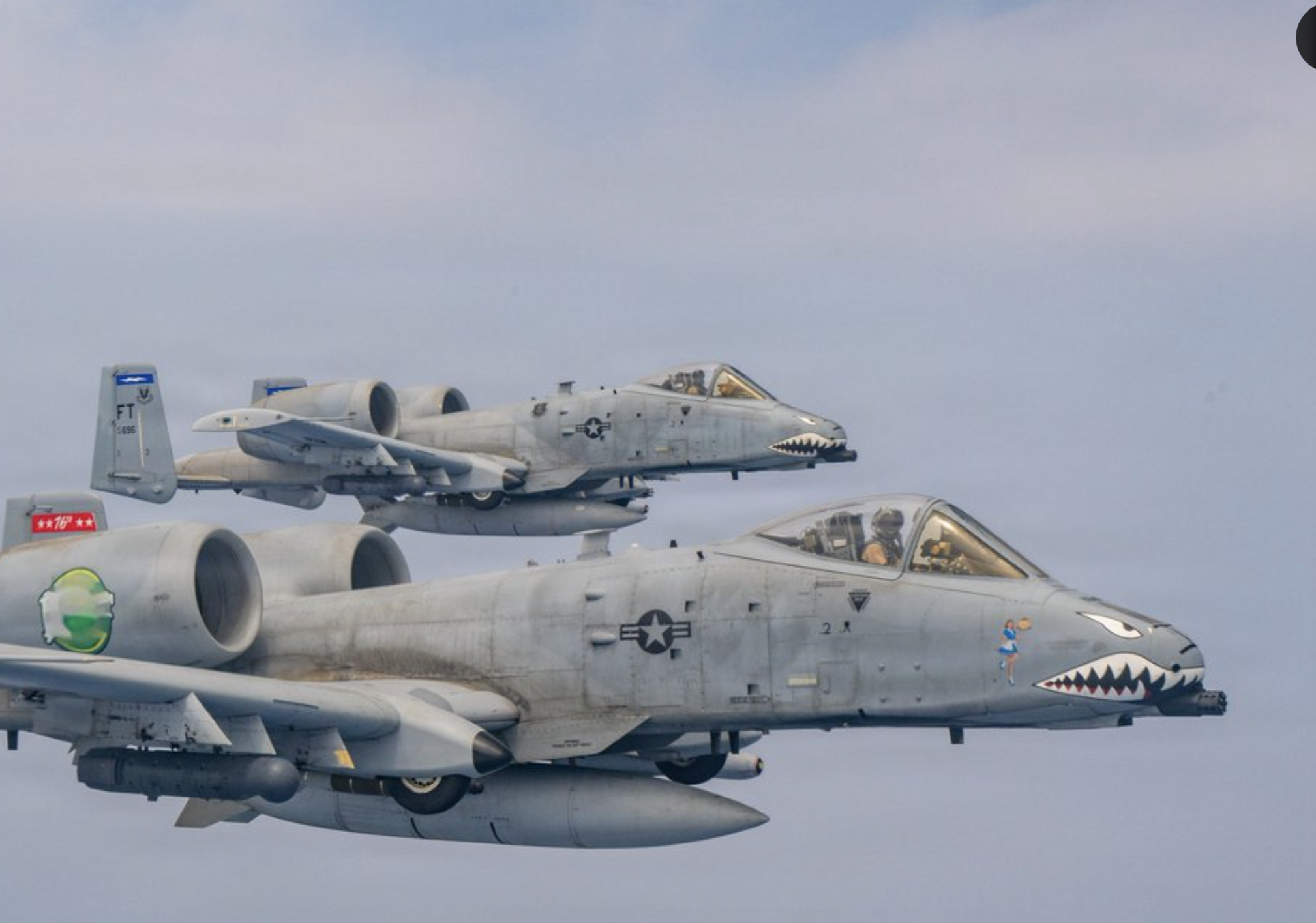 Two U.S. Air Force A-10 aircraft patrol the skies over the Middle East during scheduled daytime flight operations. Photo U.S. Central Command