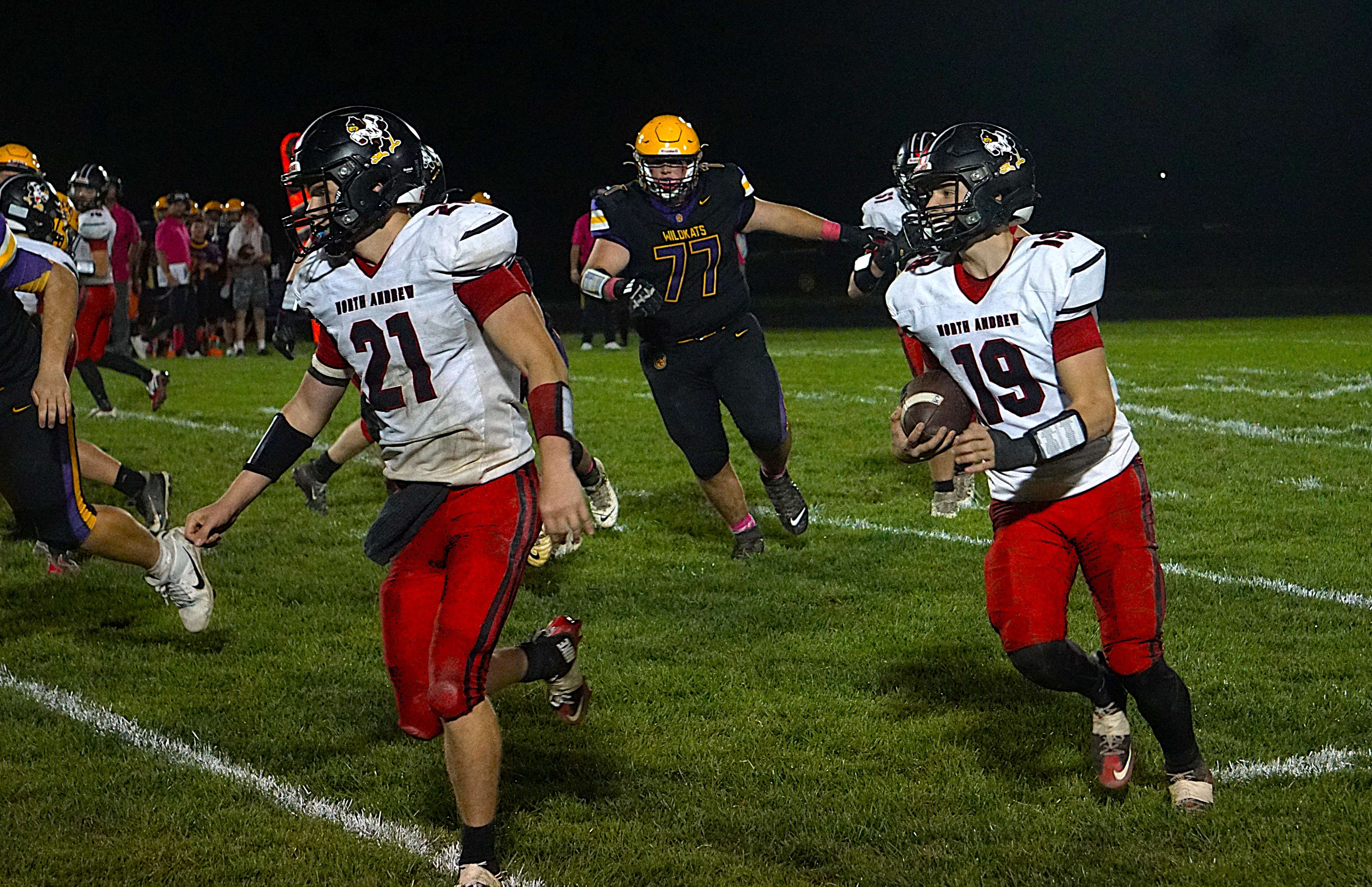 North Andrew's Levi McAfee follows his blocks running downfield/ Photo by Matt Pike