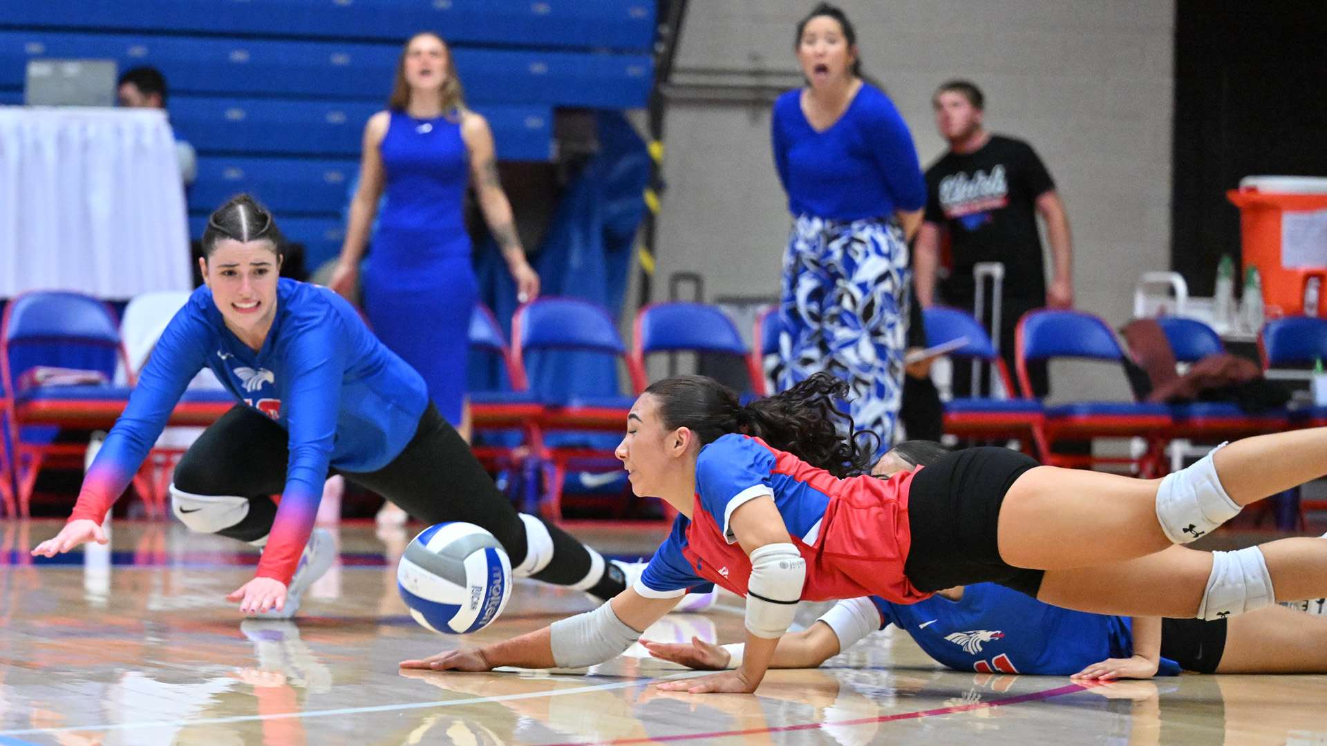Sophomore Clara Oliveira pancakes one of her season-high 27 digs in the Blue Dragons' four-set win over Garden City on Wednesday at the Sports Arena. (Andrew Carpenter/Digital Fox Photography)