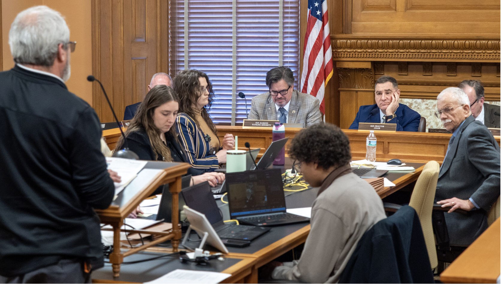 Rep. Pat Proctor, chair of the House Elections Committee, listen to testimony during a Jan. 27, 2026, hearing on legislation that adds restrictions to delivering advance ballots. (Photo by Sherman Smith/Kansas Reflector)