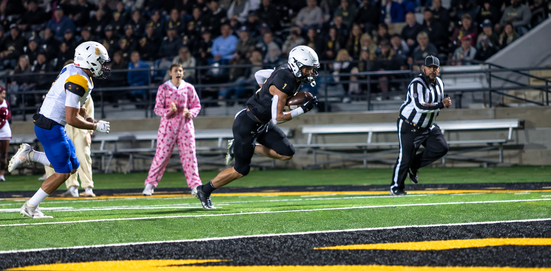 TMP's Grant Nehls headed to the endzone against Bluestem. Photo by Alin Hett/Hays Post