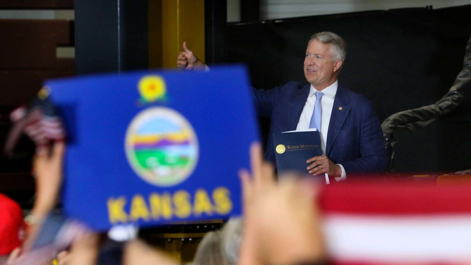 U.S. Sen. Roger Marshall gestures to the crowd at an Oct. 26, 2026, rally in Topeka with Vice President JD Vance. (Photo by Thad Allton for Kansas Reflector)