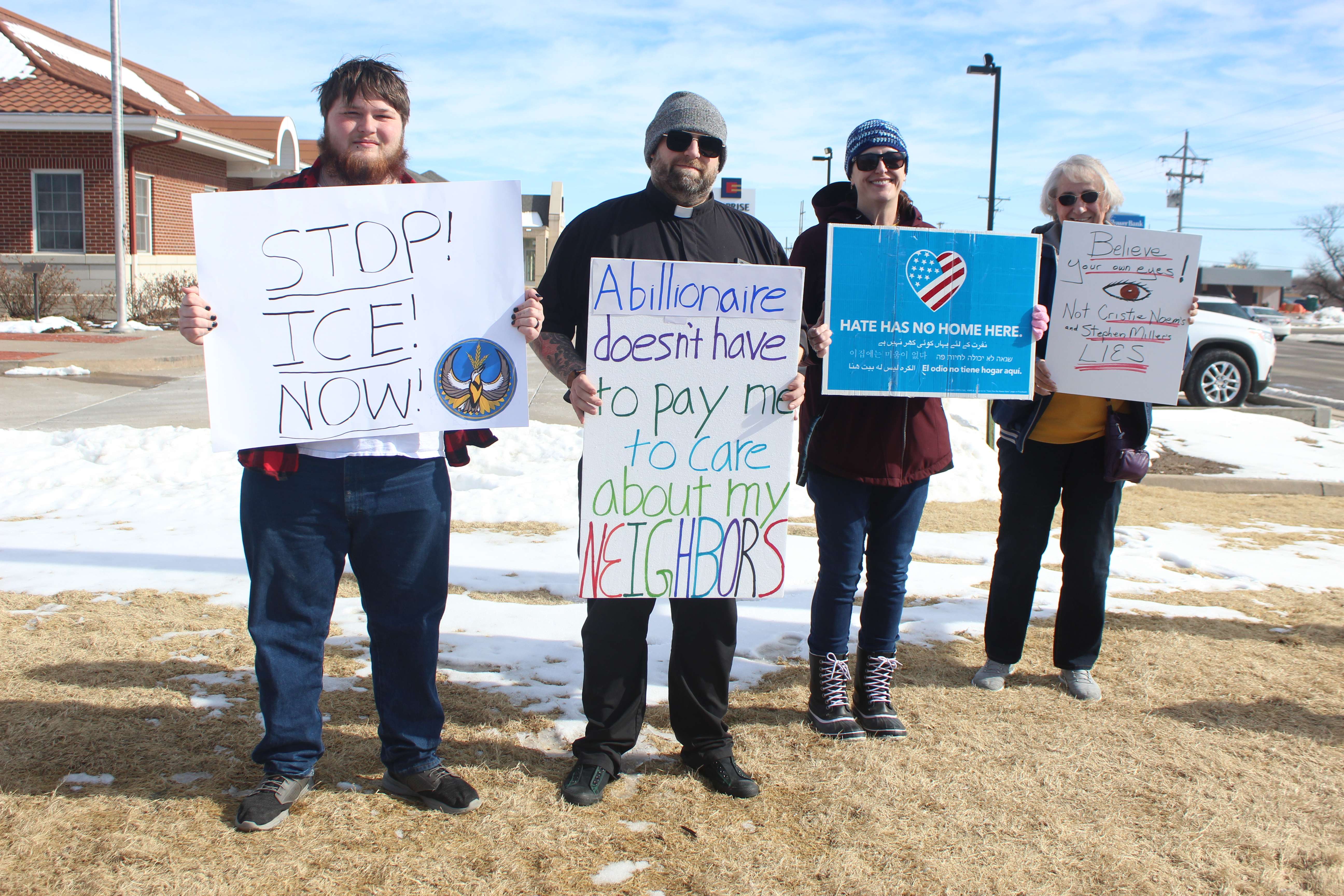 Pastor Ben Houchen, center, said he wants the country to come together to protect basic humanity.&nbsp;Photo by Cristina Janney/Hays Post