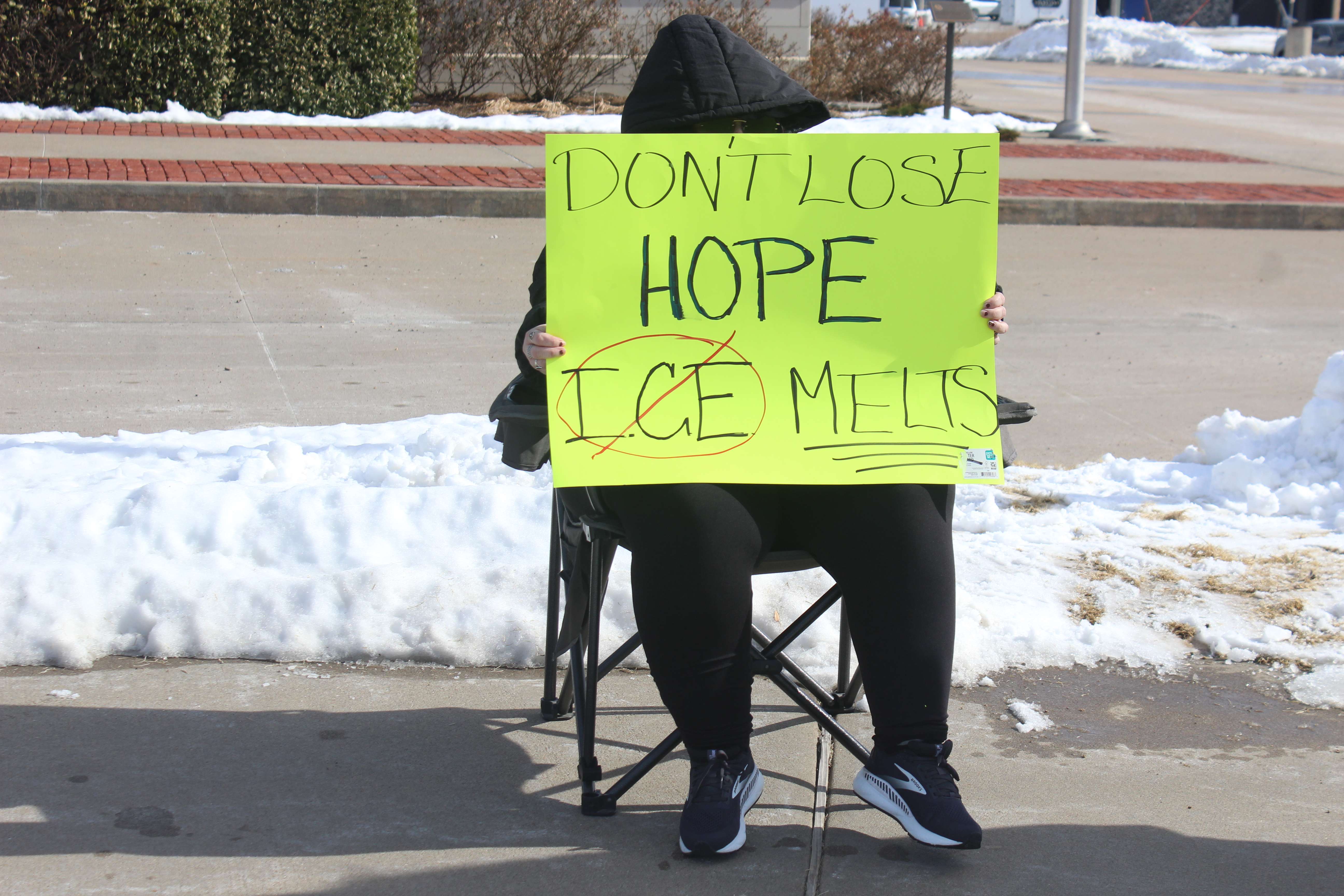Protester Sunday at 27th and Vine in Hays. Photo by Cristina Janney/Hays Post