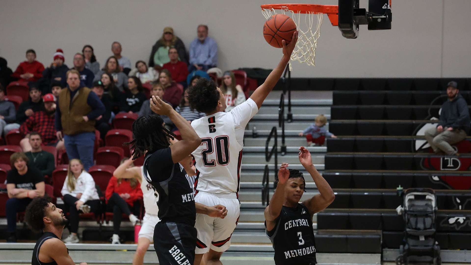 Benedictine's Brycen LaRue (20) goes for a layup against Central Methodist. LaRue was recently named the Heart Men's Offensive Player of the Week/ Photo courtesy of Raven Athletics