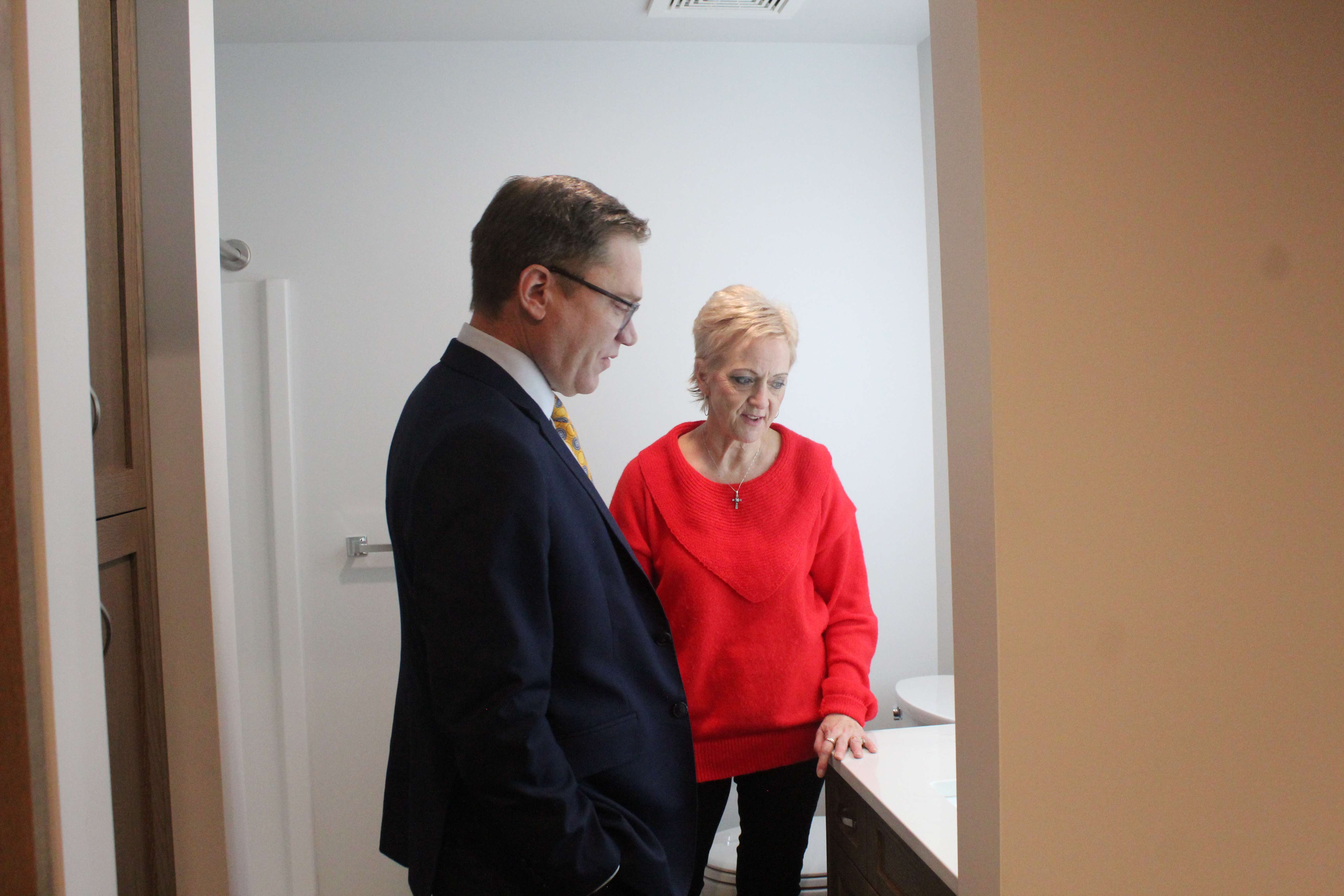Toland touring one of the St. John's Place apartments with Brenda Dreiling of the Victoria Community Coalition. The complex includes&nbsp;one-bedroom, two-bedroom and studio independent senior-living apartments. Photo by Cristina Janney/Hays Post