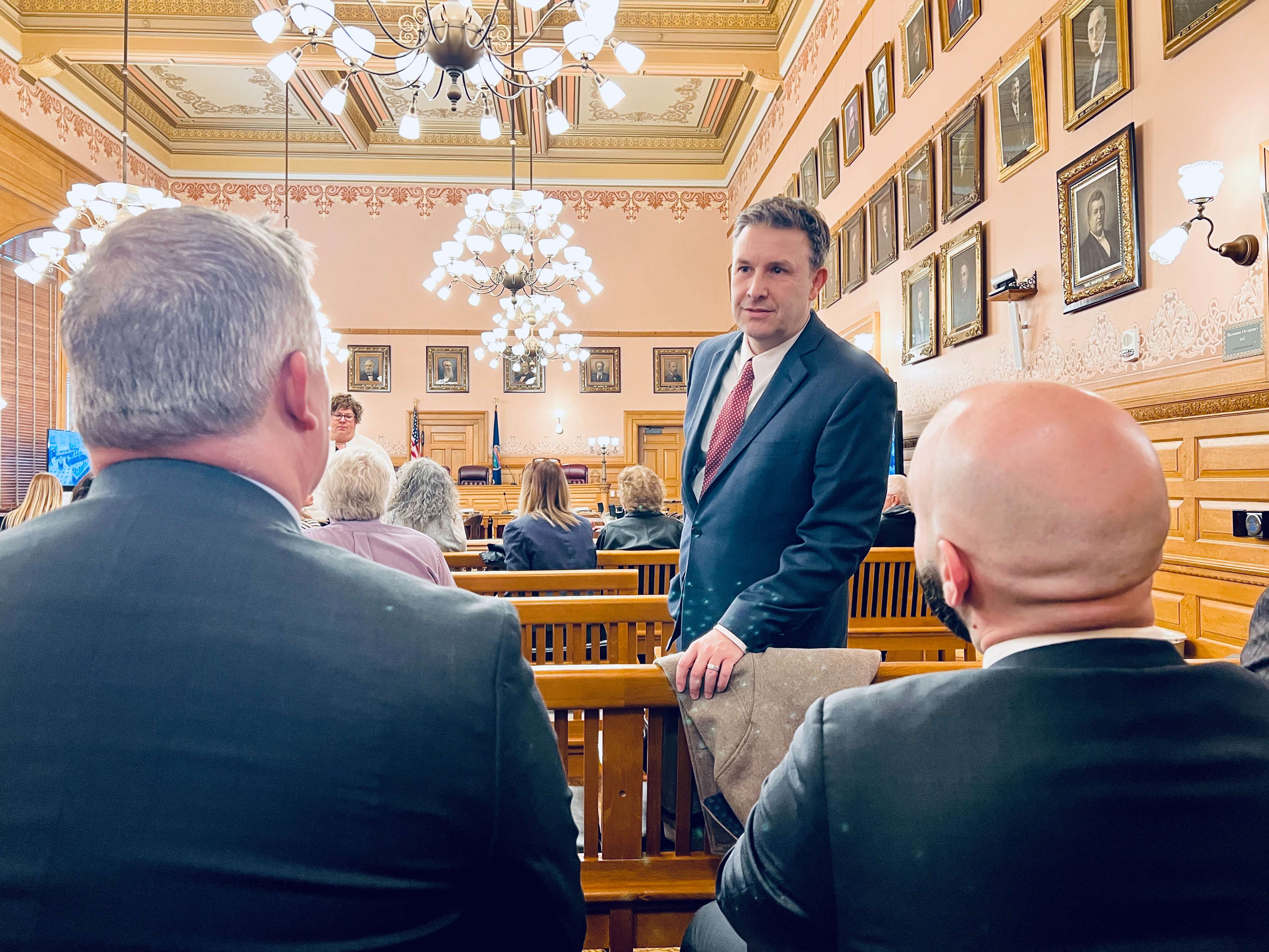 Leavenworth County Attorney Todd Thompson in conversation with members of his office prior to giving testimony before the Senate Committee in Judiciary on Feb. 4, 2026 (Photo courtesy Micah Bray)