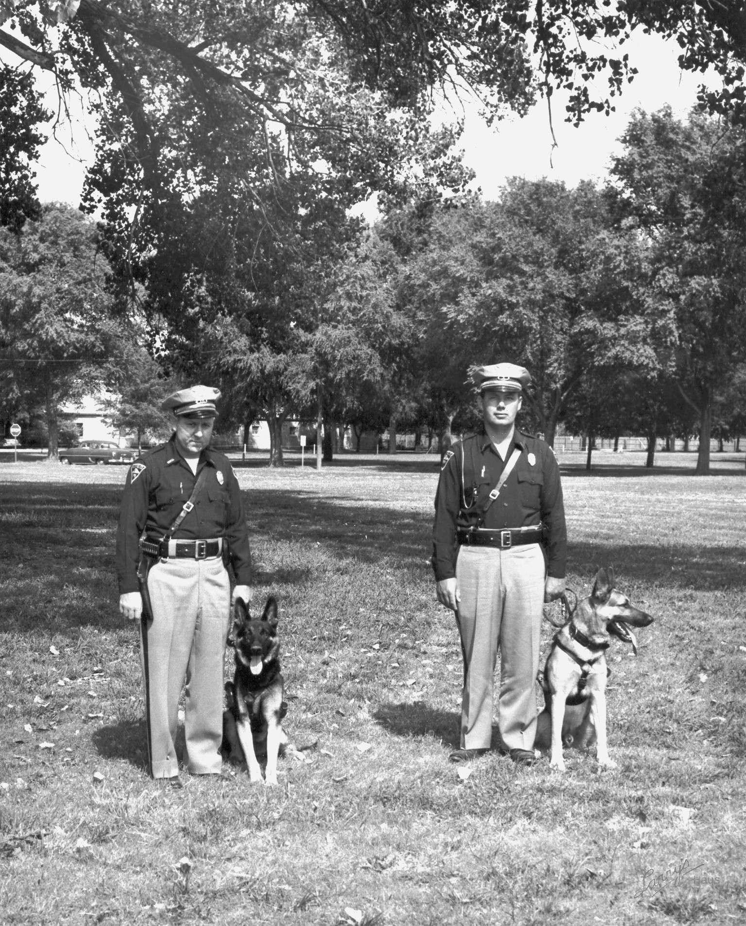 Former Hays Police Chief Lawrence "Jug" Younger (right) with a K9. Courtesy photo