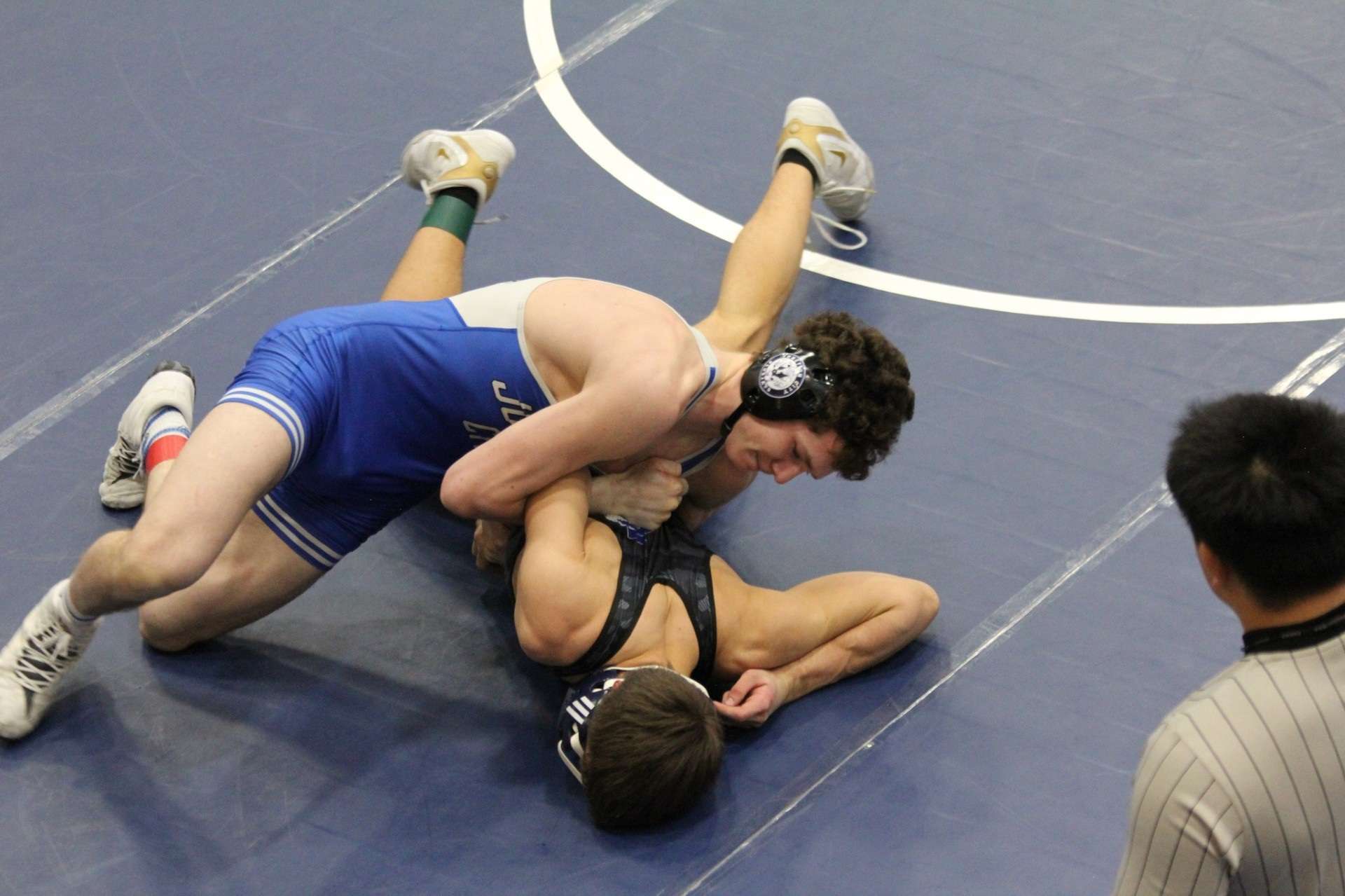 Pictured is 165 lbs Cody Owens getting a 16-1 technically fall win over Washburn Rural s Caleb Schwartz.&nbsp;