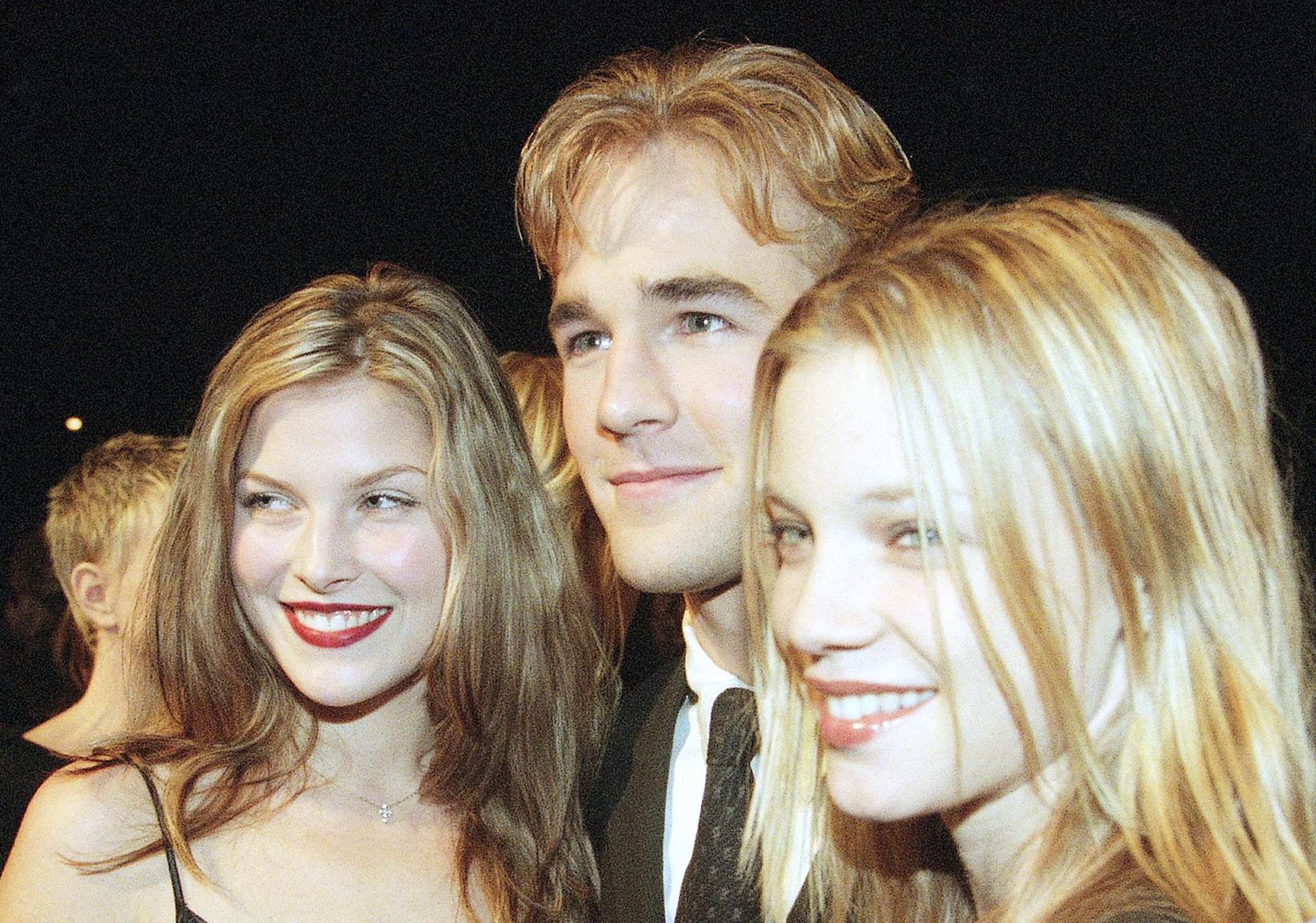 FILE - Actors Ali Larter, left, poses with co-stars James Van Der Beek, center, and Amy Smart at the premiere of "Varsity Blues" in Los Angeles on Jan. 7, 1999. (AP Photo/Chris Pizzello, File)
