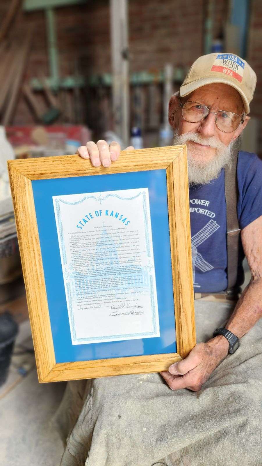 Felten with a resolution from the Kansas House of Representatives honoring him on his 90th birthday. Courtesy photo