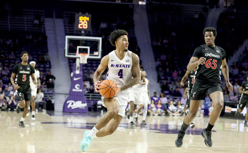 Kansas State guard P.J. Haggerty (4) drives to the basket against Cincinnati's Halvine Dzellat (65) Thursday, February 11, 2026 in Manhattan, Kan. (Kansas State Athletics photo)