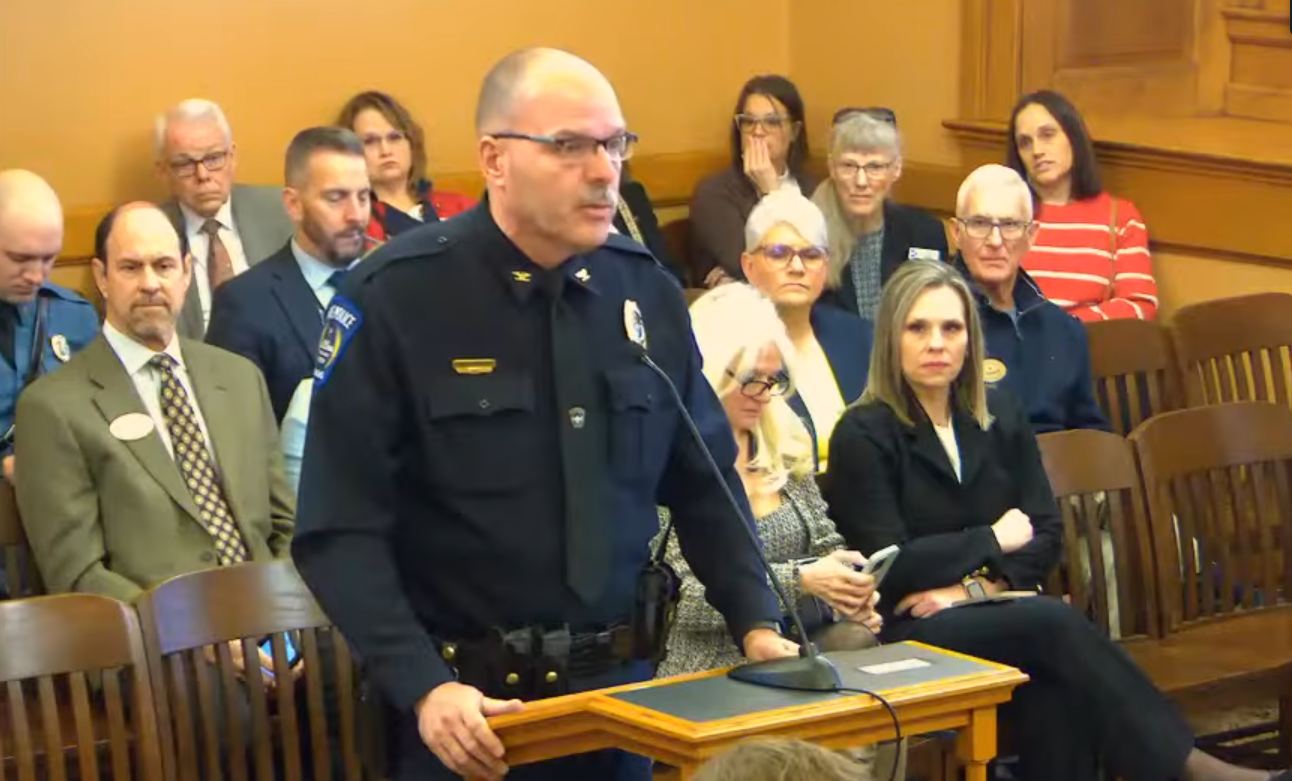 Hays Police Chief Don Scheibler testifies before the Senate Committee on Transportation on Feb. 11 in Topeka to support Senate Bill 445 and share his department's experience receiving assistance from the Kansas Highway Patrol and the Kansas Bureau of Investigation in the aftermath of Sgt. Scott Heimann's death. Screen capture of Kansas Legislature video