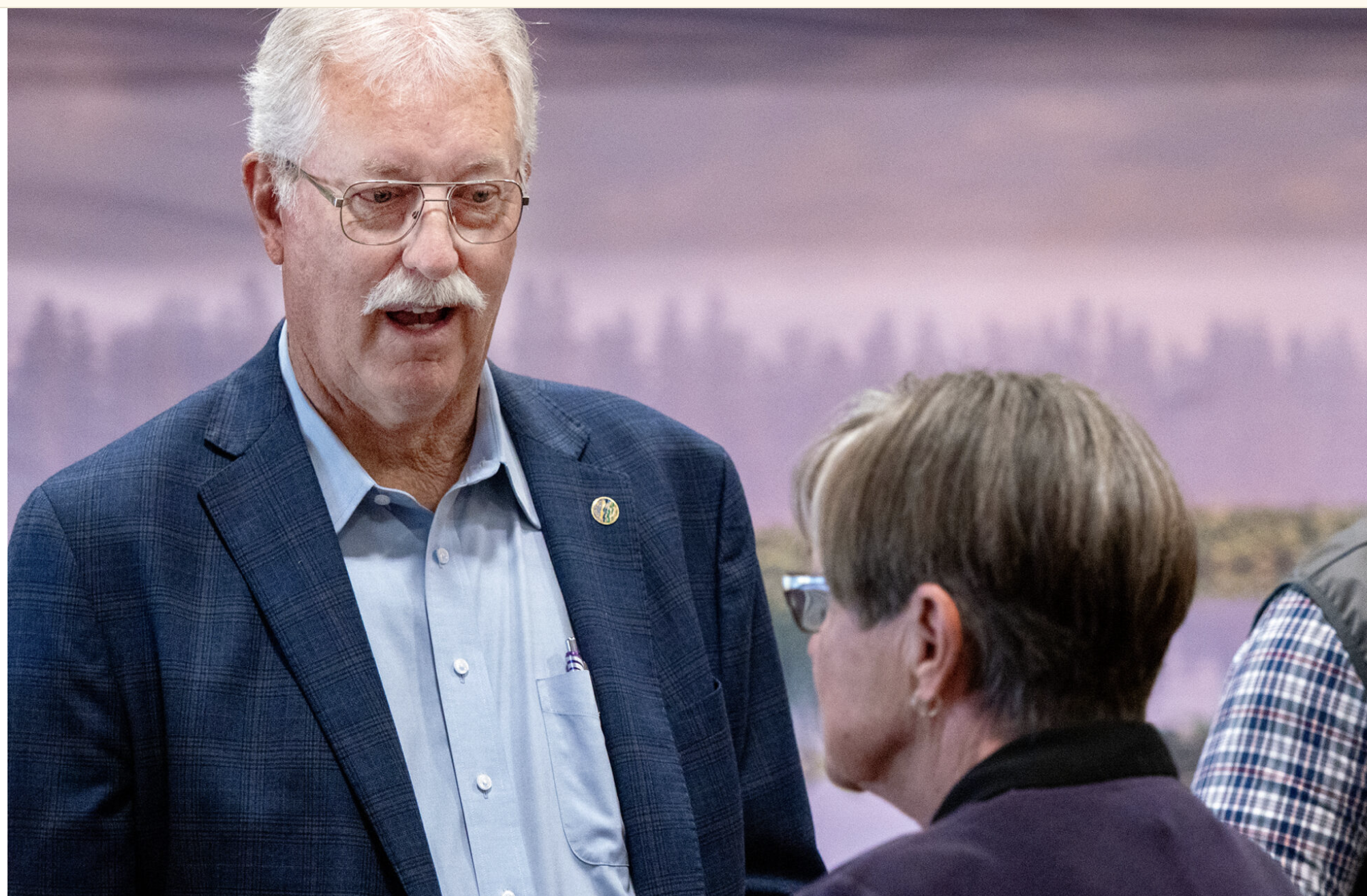  Rep. Jim Minnix talks with Gov. Laura Kelly at a July 9, 2025, news conference on water at the Sternberg Museum of Natural History in Hays. (Photo by Sherman Smith/Kansas Reflector)