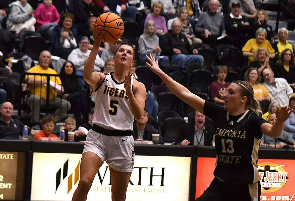 Fort Hays State guard Brooke Loewe (5) goes in for a layup against Emporia State's Kaylin Noonan (13) in the second half of the NCAA college basketball game on Thursday, February 12, 2026 in Hays, Kan. (FHSU Athletics photo/Nicole Heitmann)