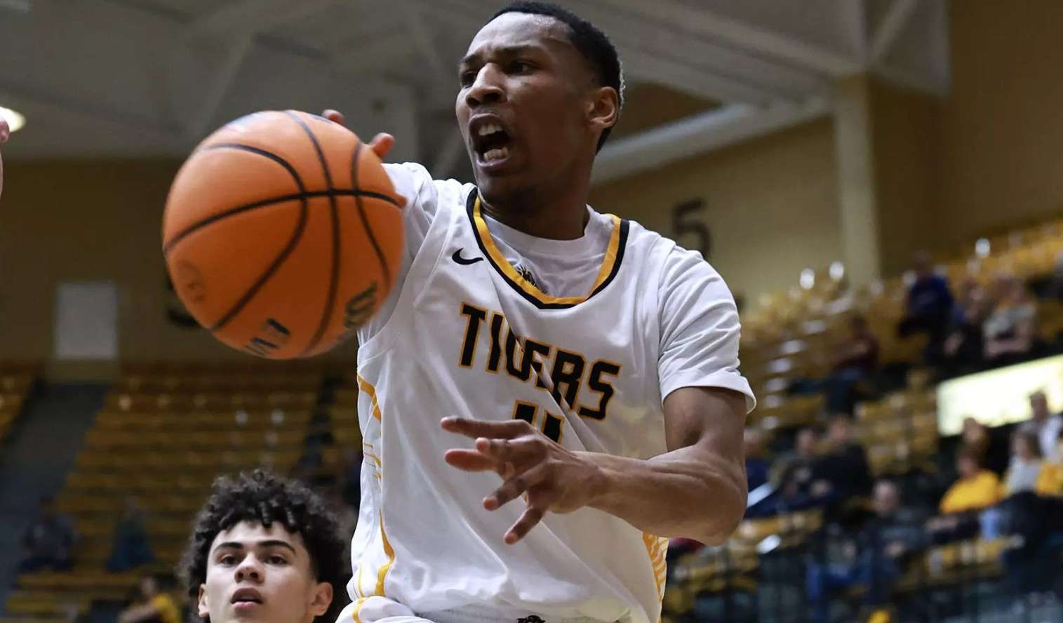 Fort Hays State's Jahvari Martino (4) saves the ball from going out of bounds in the second half of their game with Emporia State on Thursday, February 12, 2025 in Hays, Kan, (FHSU Athletics photo/Parker Nisbeth)
