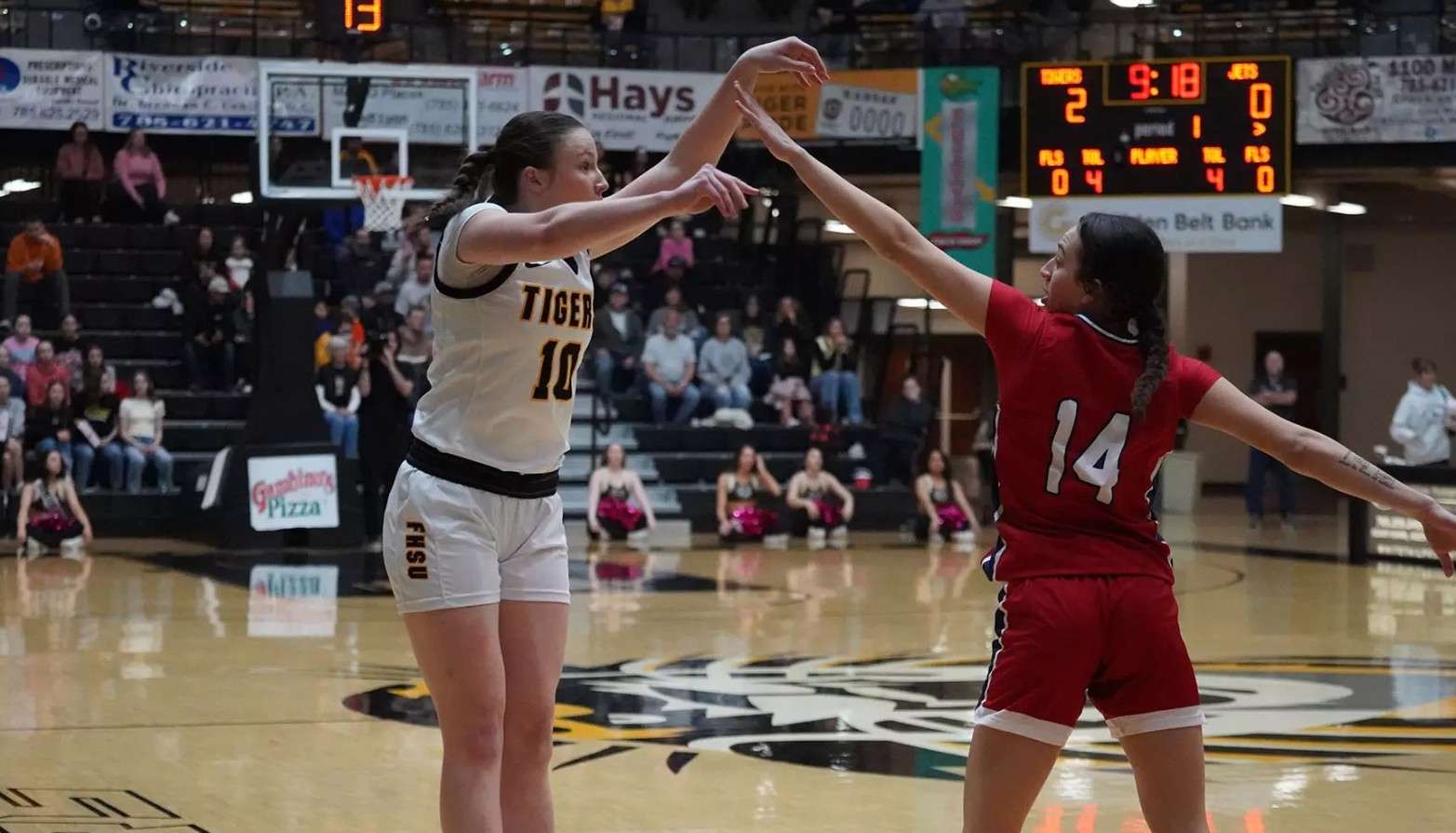 Fort Hays State freshman guard Olivia Mortensen attempts a three-pointer over Newman's Amaya Perez (14) in the first half of an NCAA college basketball game on Saturday, February 14, 2026 in Hays, Kan. (FHSU Athletics photo/Gillian Lynch)