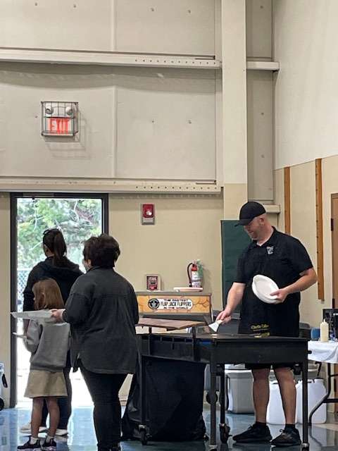 Pancakes are flipped and served during an earlier Sunflower Diversified Services Pancake Feed. This year’s event is set for March 26.
