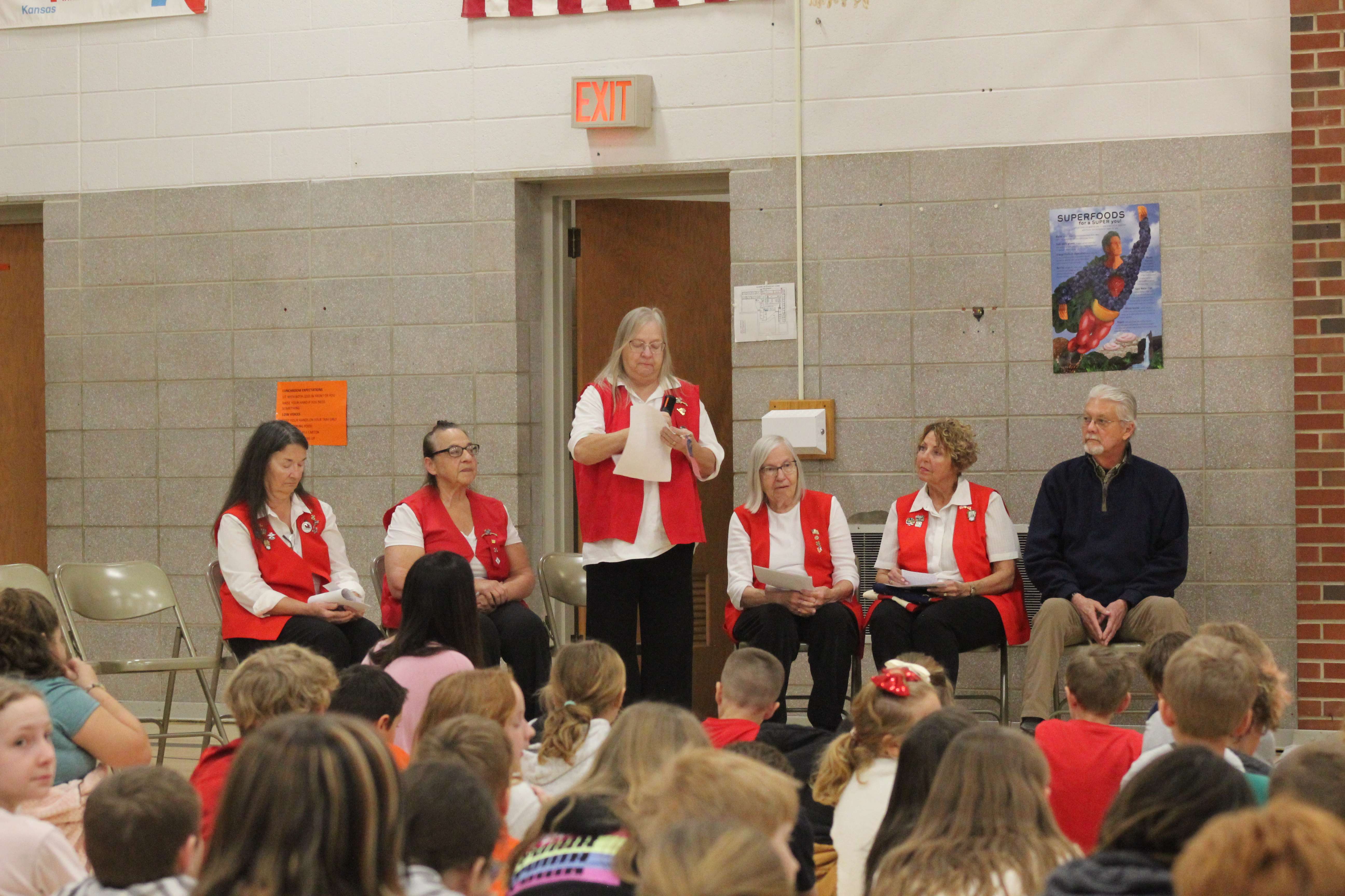 Members of the VFW Auxiliary in Ellis gave a presentation on the 250th anniversary of the signing of the Declaration of Independence and facts on flag etiquette to Washington Grade School students on Monday. Photo by Cristina Janney/Hays Post