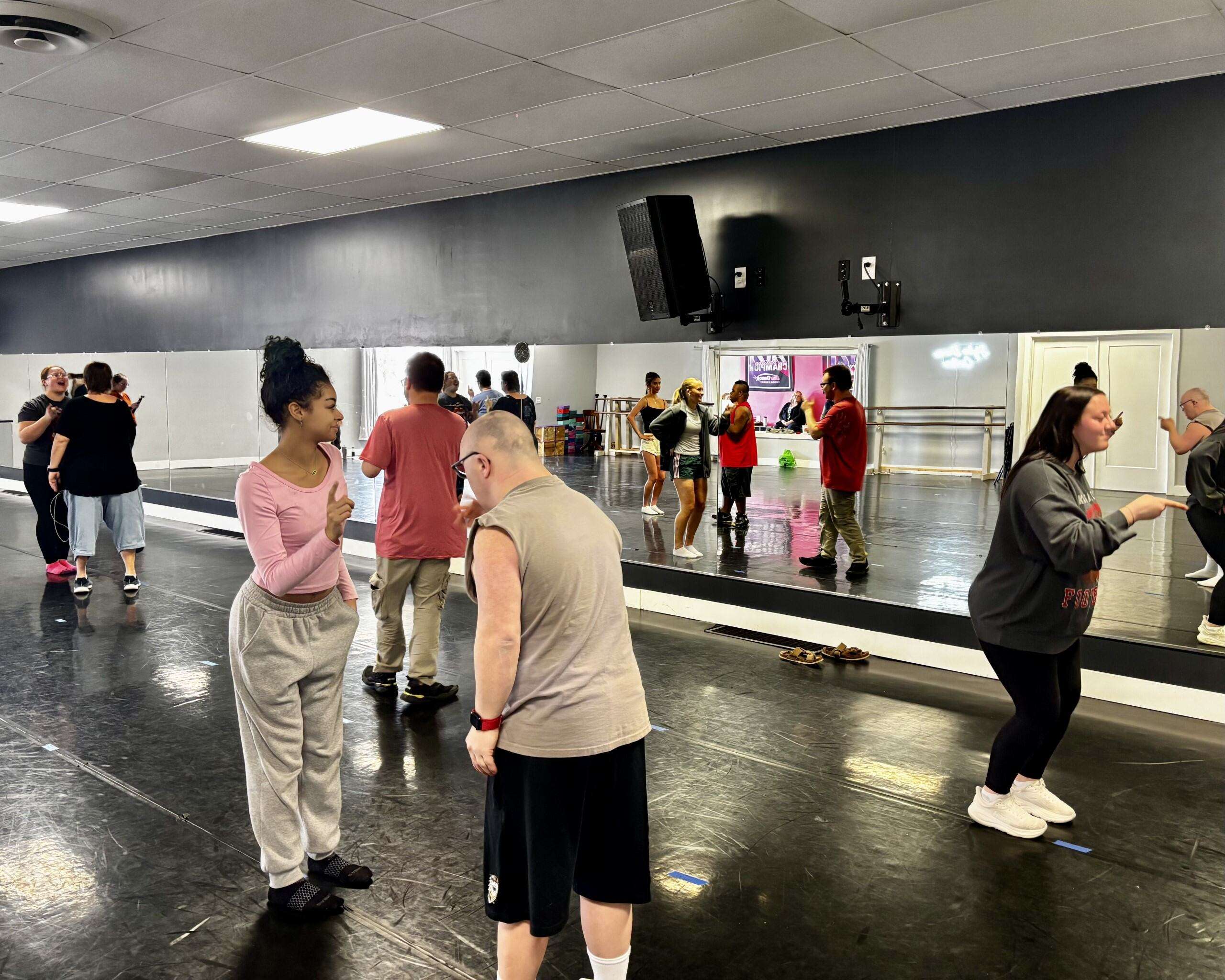A dancer with Styles Dance Centre paired with a Development Services of Northwest Kansas participant during rehearsals. Photo by Tony Guerrero/Hays Post