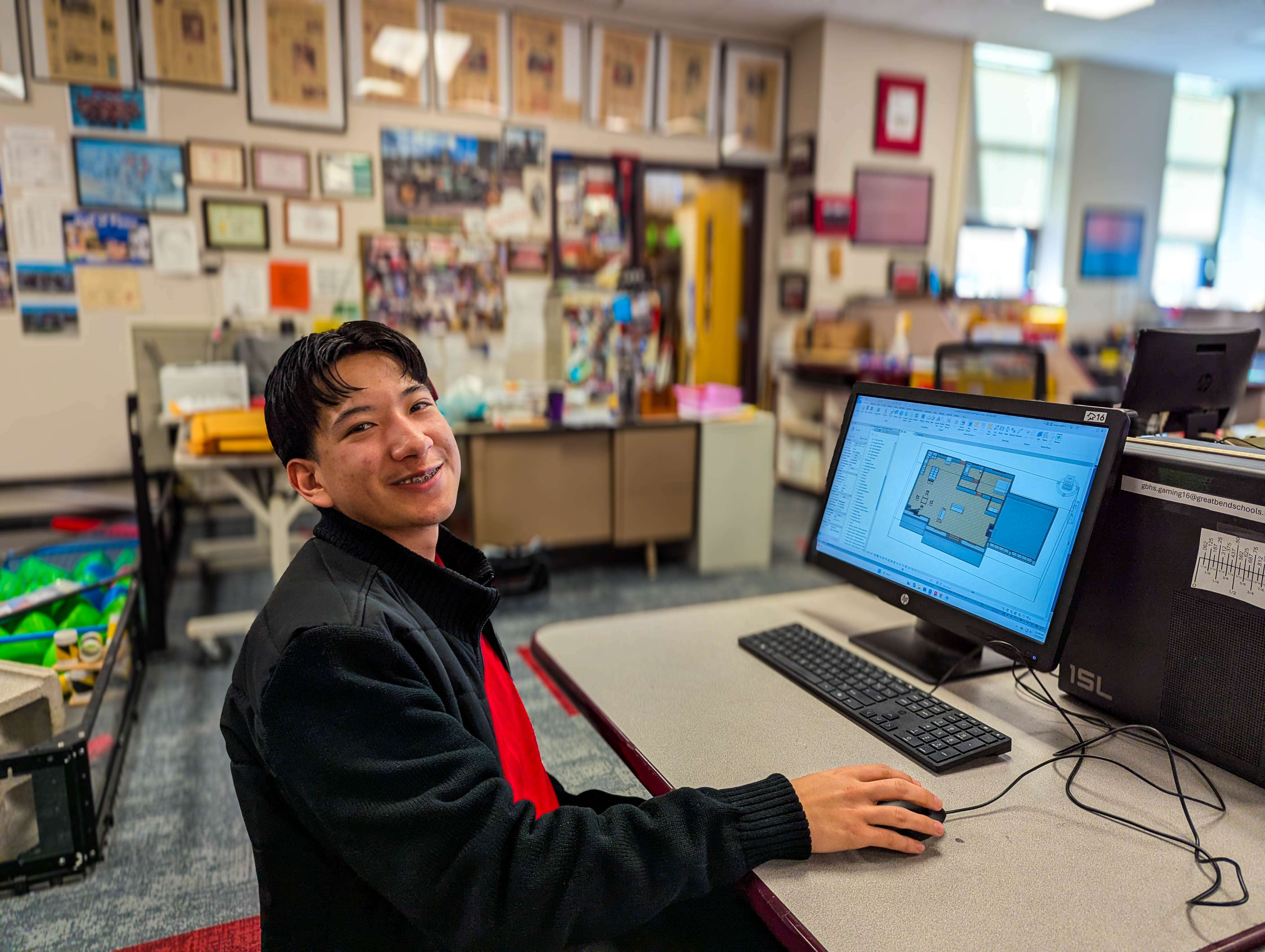 Senior Sergio Rodriguez demonstrates how he uses CAD software to transform flat 2D blueprints into immersive 3D renderings.