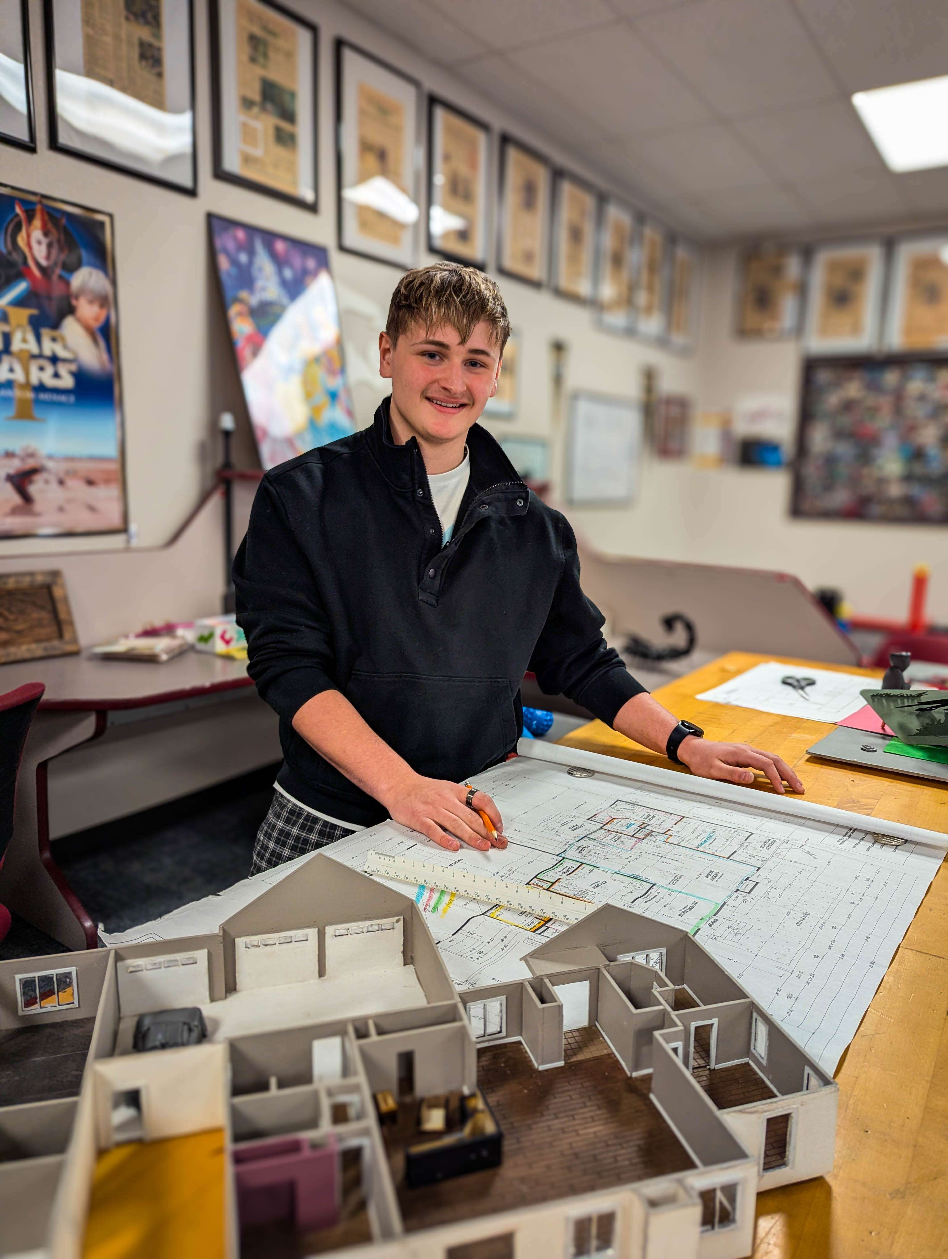 Precision in practice: GBHS junior Slayde Apley uses a 1/4-inch scale to translate real-world blueprints into a detailed architectural model, a project he has been refining since kindergarten. While his earliest versions were crafted from popsicle sticks and foam board, his current capstone project utilizes professional-level expertise and accumulated skills.