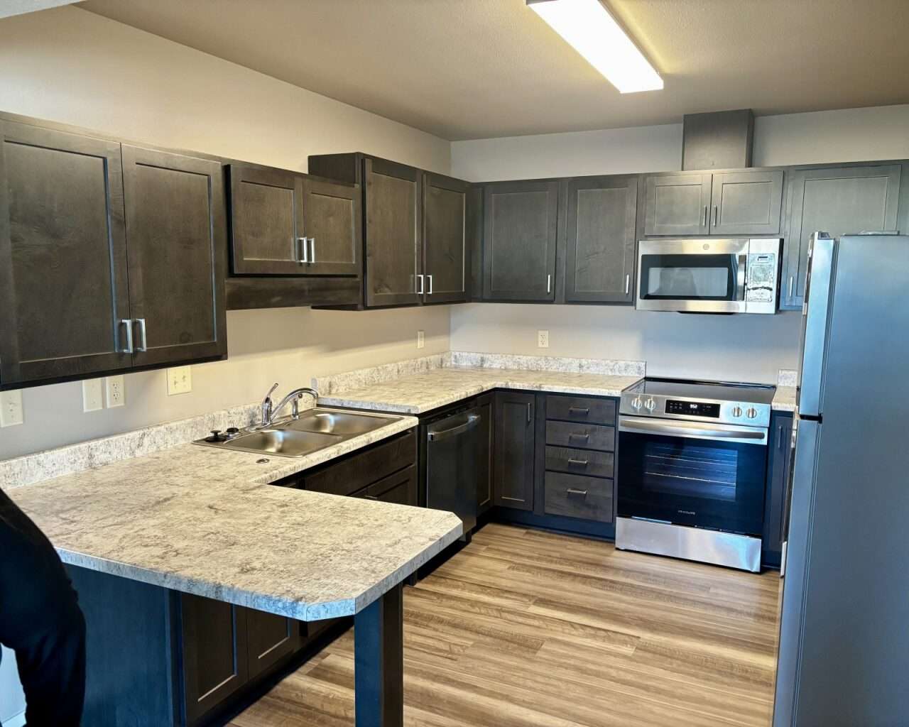 The kitchen space of an ADA-compliant unit at Flintwood Senior Housing in Russell with lowered countertops and cabinets. Photo by Tony Guerrero/Hays Post