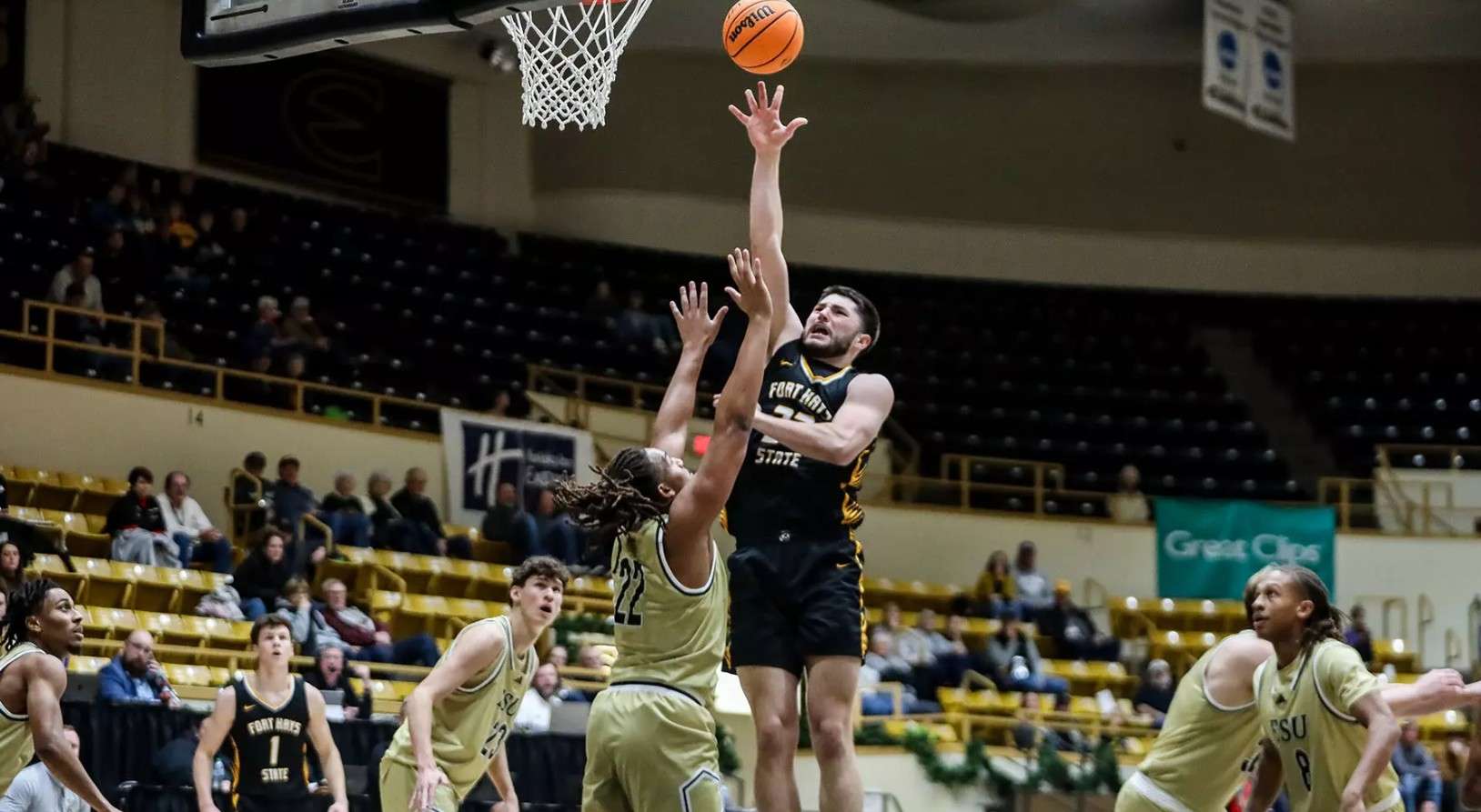 Fort Hays State forward Eli Lawson (32) attempts a shot over Emporia State's Treyvon Taylor on Thursday, January 8, 2026 in Emporia, Kan. (FHSU Athletics photo/Mason Hart, ESU Athletics)