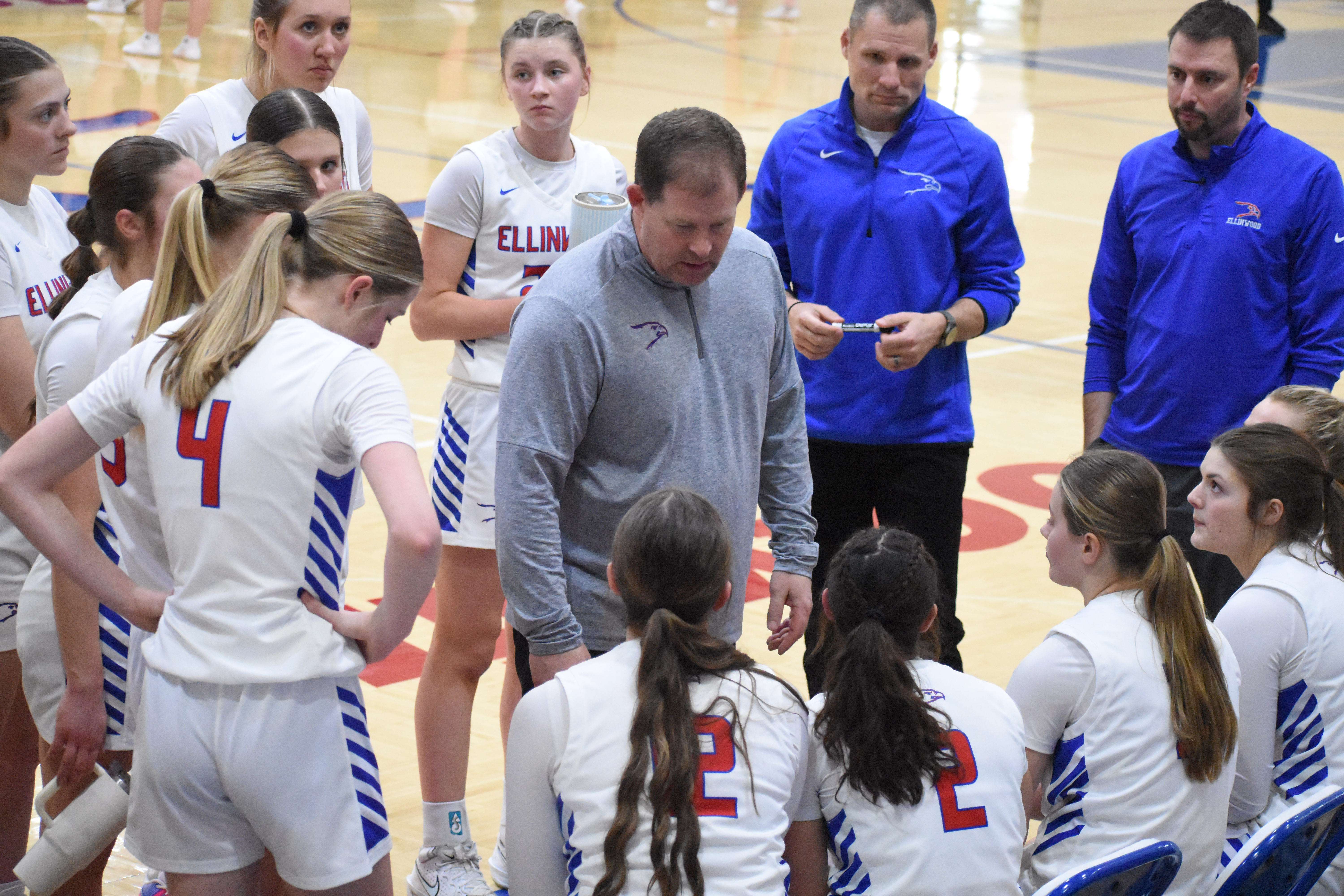 Ellinwood High School Coach Greg Maxwell speaks to his team during a timeout in Friday's regular-season finale against Otis-Bison