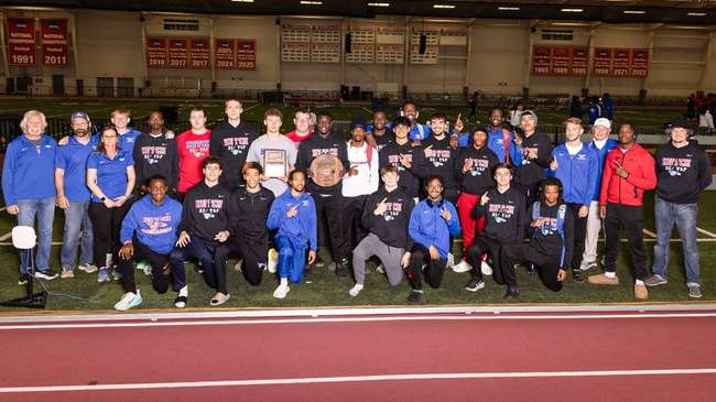 The Blue Dragon men's indoor track team celebrates its second Region 6 indoor title at the Plaster Center at Pittsburg State University in Pittsburg, Kansas. (Photo Courtesy: Ed Bailey)