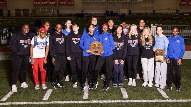 The Blue Dragon women's indoor track and field team celebrates its first-ever Region 6 championship at the Plaster Center at Pittsburg State University in Pittsburg, Kansas. (Photo courtesy: Ed Bailey)