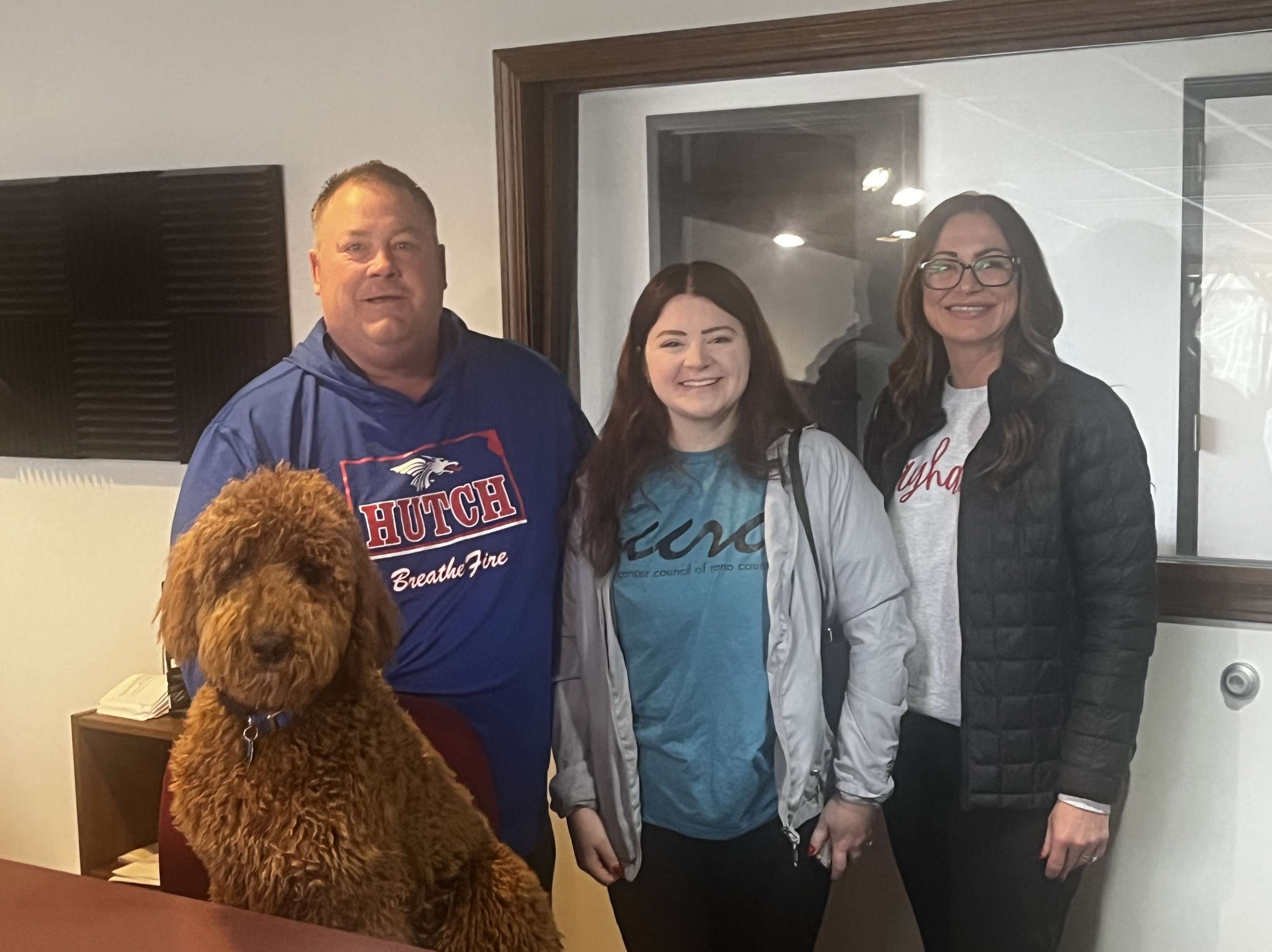 HutchCC Athletic Director Josh Gooch, Katie Brown and Ashley Thompson of the Cancer Council of Reno County