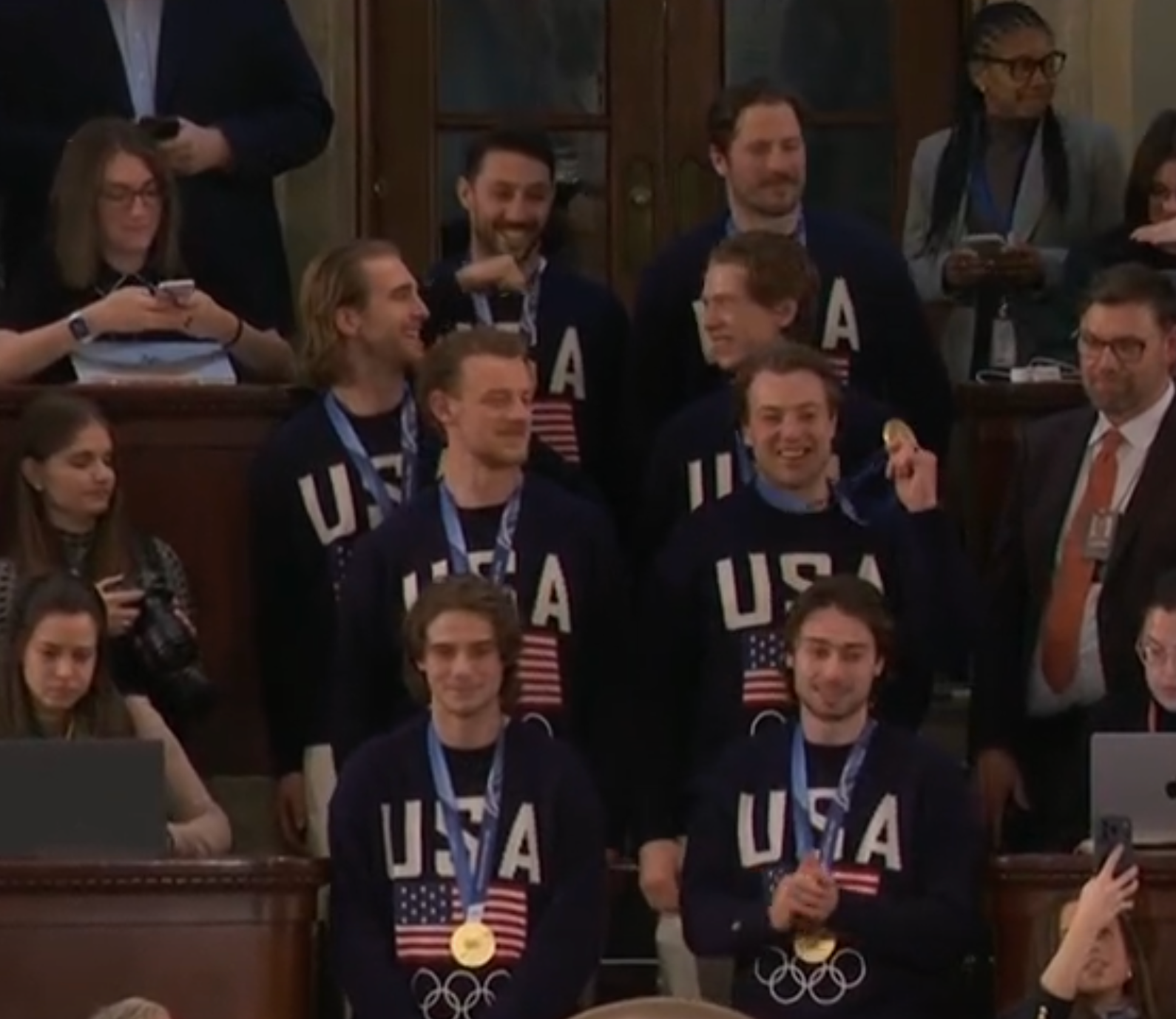 -In a rare display of bipartisanship, members of the Men’s Olympic Hockey team received a standing ovation as they entered the House chamber after a shoutout from Trump.&nbsp;Members of the team stood in the gallery seats overlooking the House floor after Trump praised them. Several smiled and waved at the crowd.&nbsp;Trump then gave a shoutout to the women’s team, who also received a standing ovation despite not being in attendance. Both teams won gold at the Winter Olympics in Milan. Image from White House video