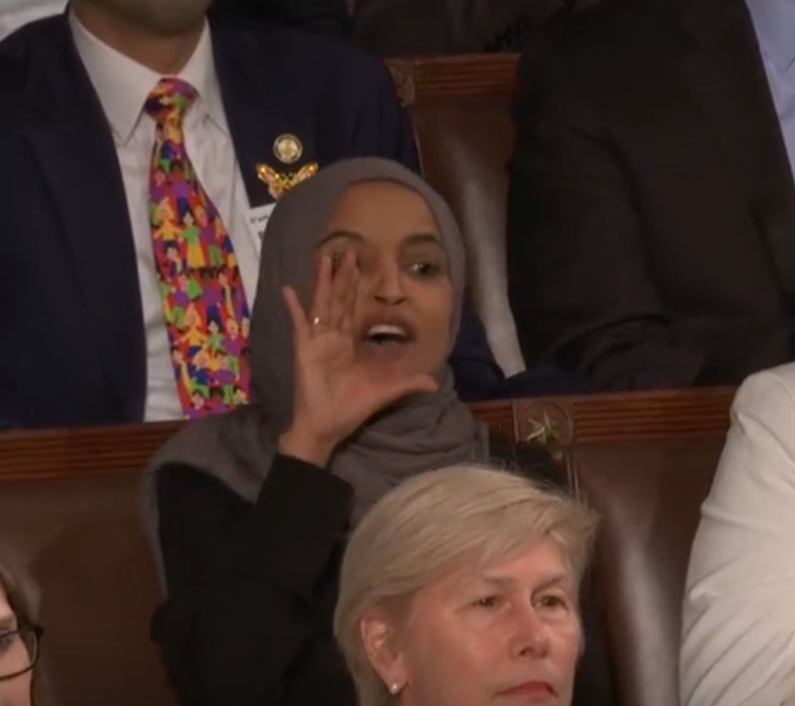 Congresswoman Ilhan Omar of Minnesota shouts at the President during the address-image from CSPAN video-
