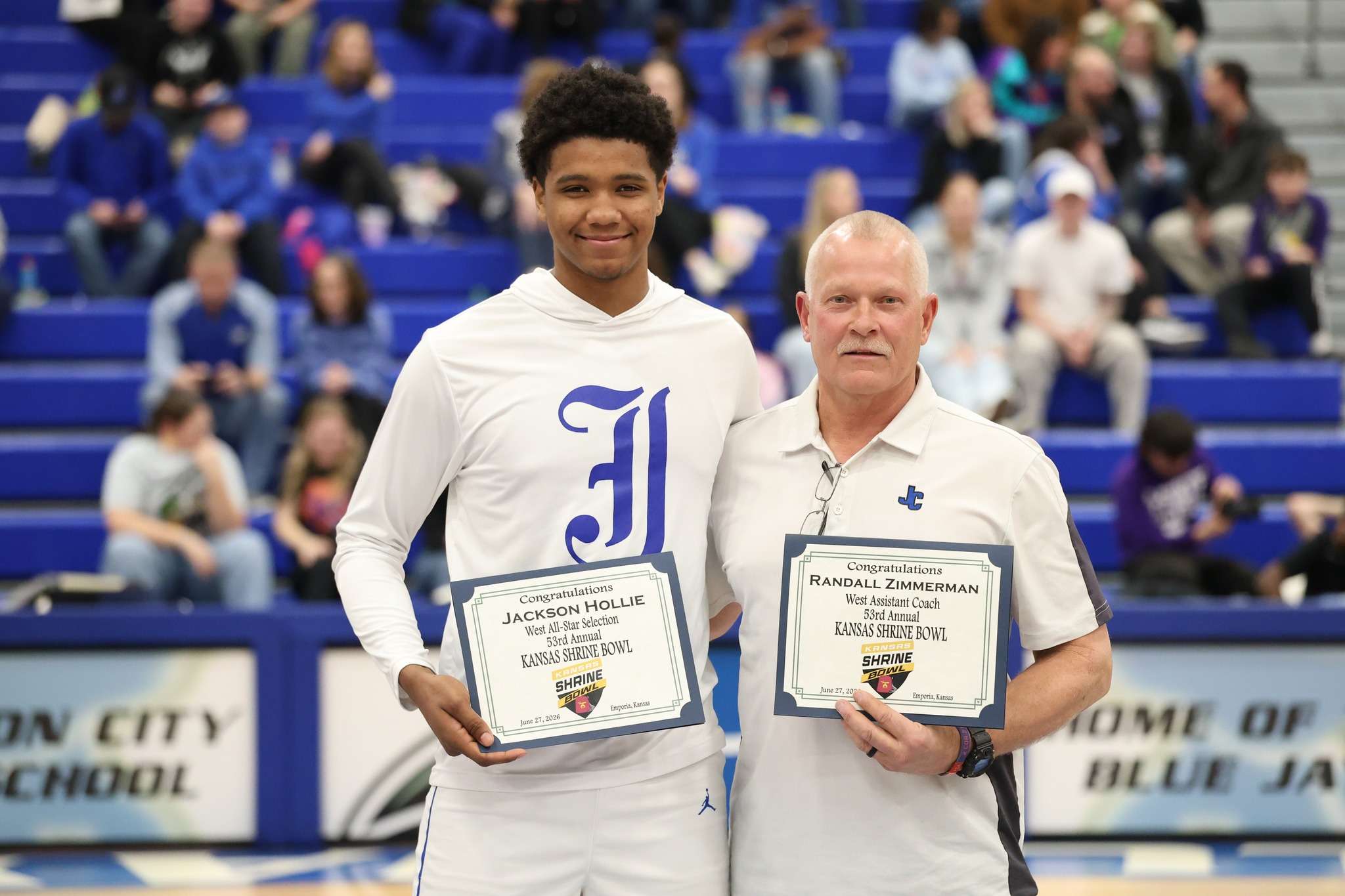 Junction City senior Jackson Hollie and Head football Coach Randall Zimmerman.