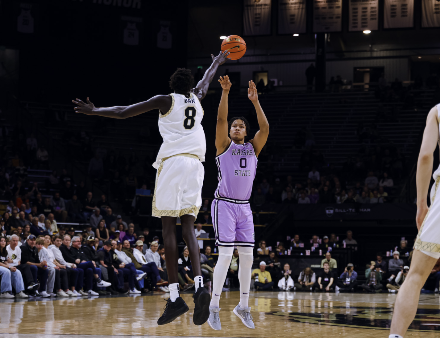 Kansas State's Elias Rapieque (0) attempts a shot over Colorado's Bangot Dak (8) on Wednesday, February 25, 2026 in Boulder, Colorado. (K-State Athletics photo)