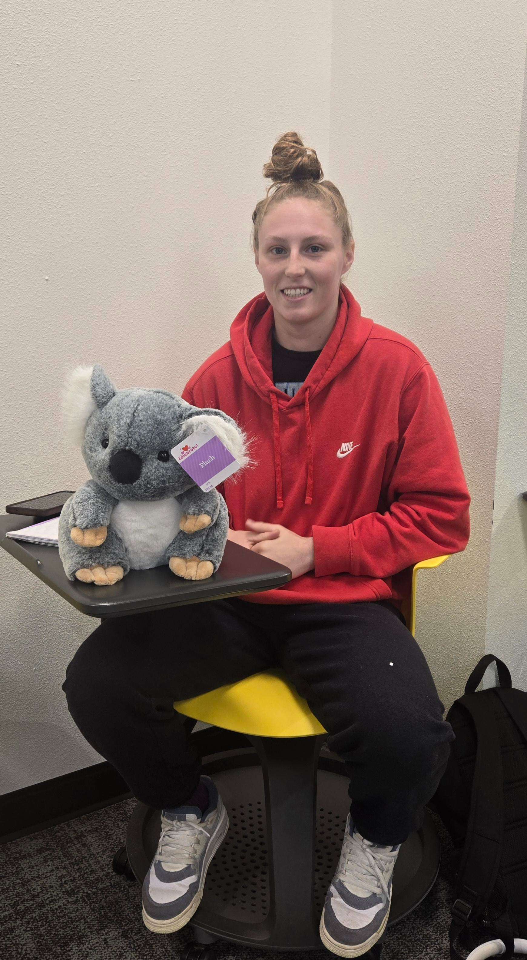 FHSU Women’s Wrestling team member Josie Houk poses with her stuffed animal donation to Ana’s Gift. Courtesy photo