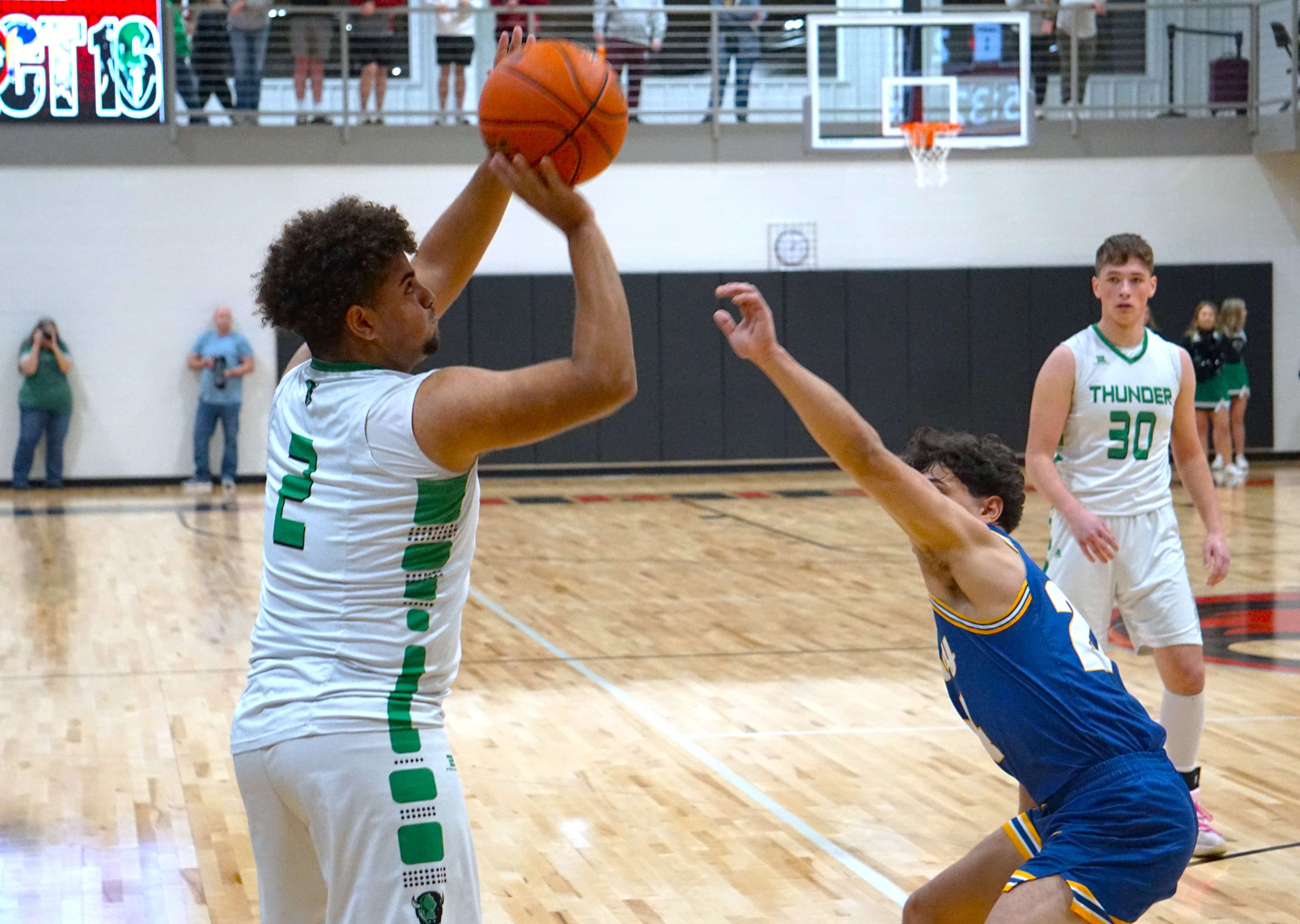Deontrae Mincy goes for three/ Photo by Matt Pike
